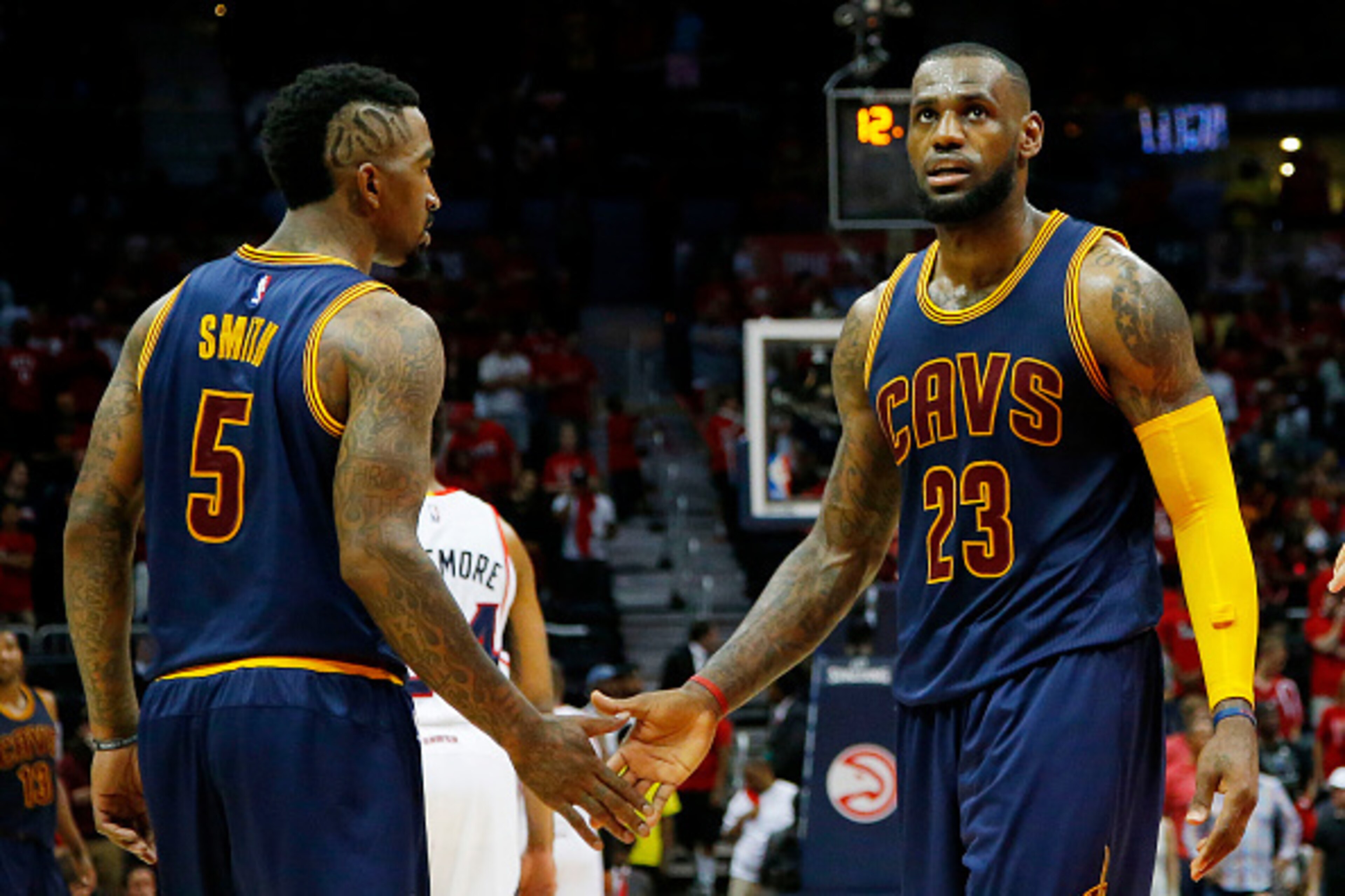 ATLANTA, GA - MAY 20:  LeBron James #23 and J.R. Smith #5 of the Cleveland Cavaliers react after Iman Shumpert #4 drew a foul in the second half against the Atlanta Hawks during Game One of the Eastern Conference Finals of the 2015 NBA Playoffs at Philips