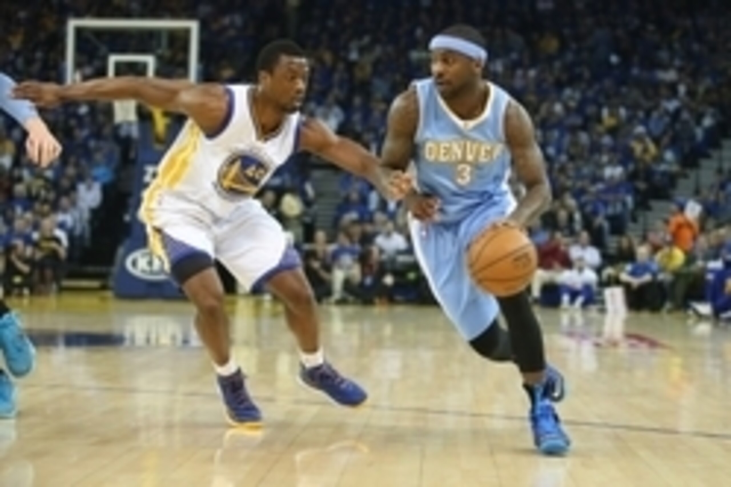 Apr 15, 2015; Oakland, CA, USA; Denver Nuggets guard Ty Lawson (3) dribbles the ball as Golden State Warriors forward Harrison Barnes (40) defends during the first quarter at Oracle Arena. Mandatory Credit: Kelley L Cox-USA TODAY Sports