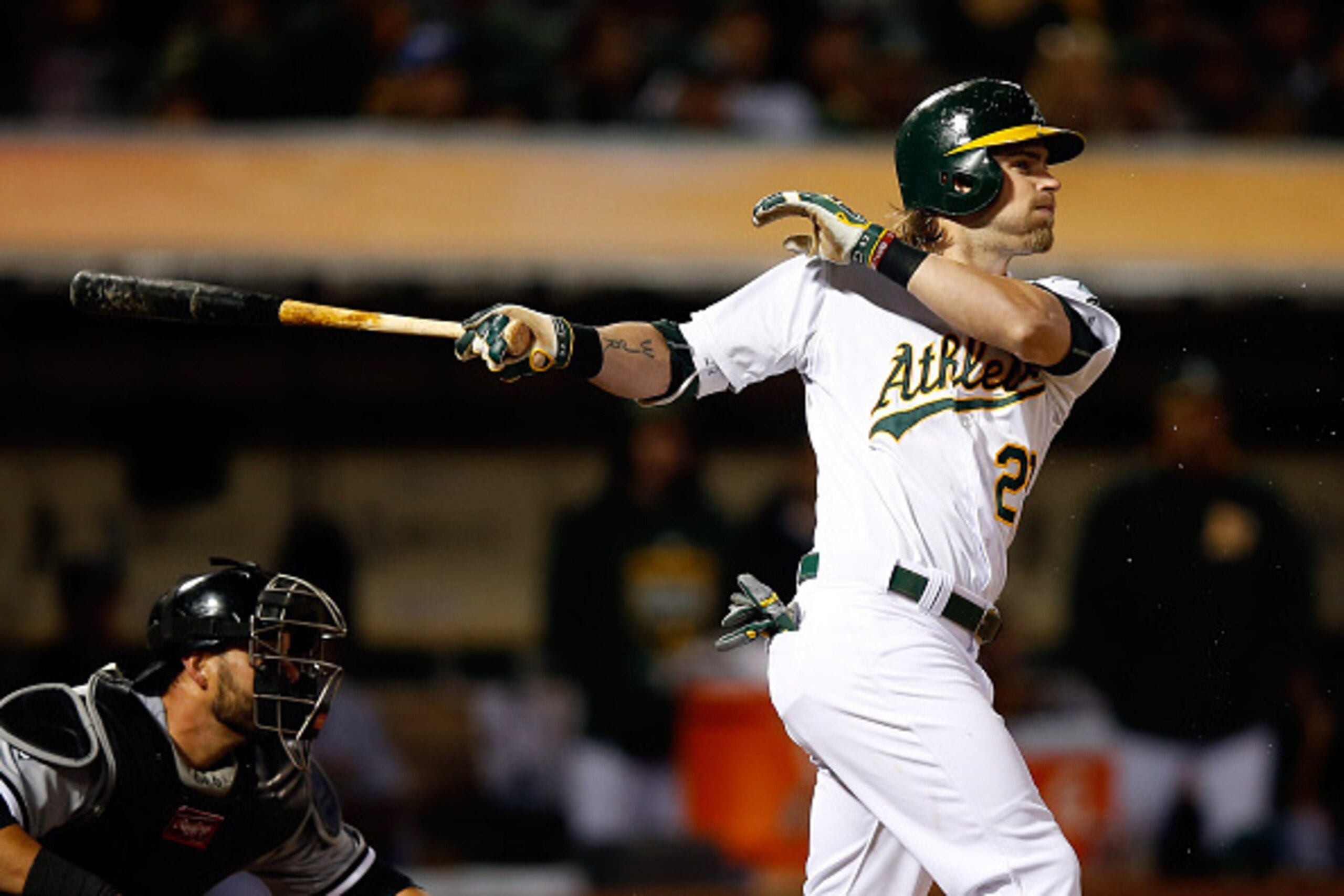 OAKLAND, CA - MAY 15:  Josh Reddick #22 of the Oakland Athletics hits a three-run triple in the fourth inning of their game against the Chicago White Sox at O.co Coliseum on May 15, 2015 in Oakland, California.  (Photo by Ezra Shaw/Getty Images)