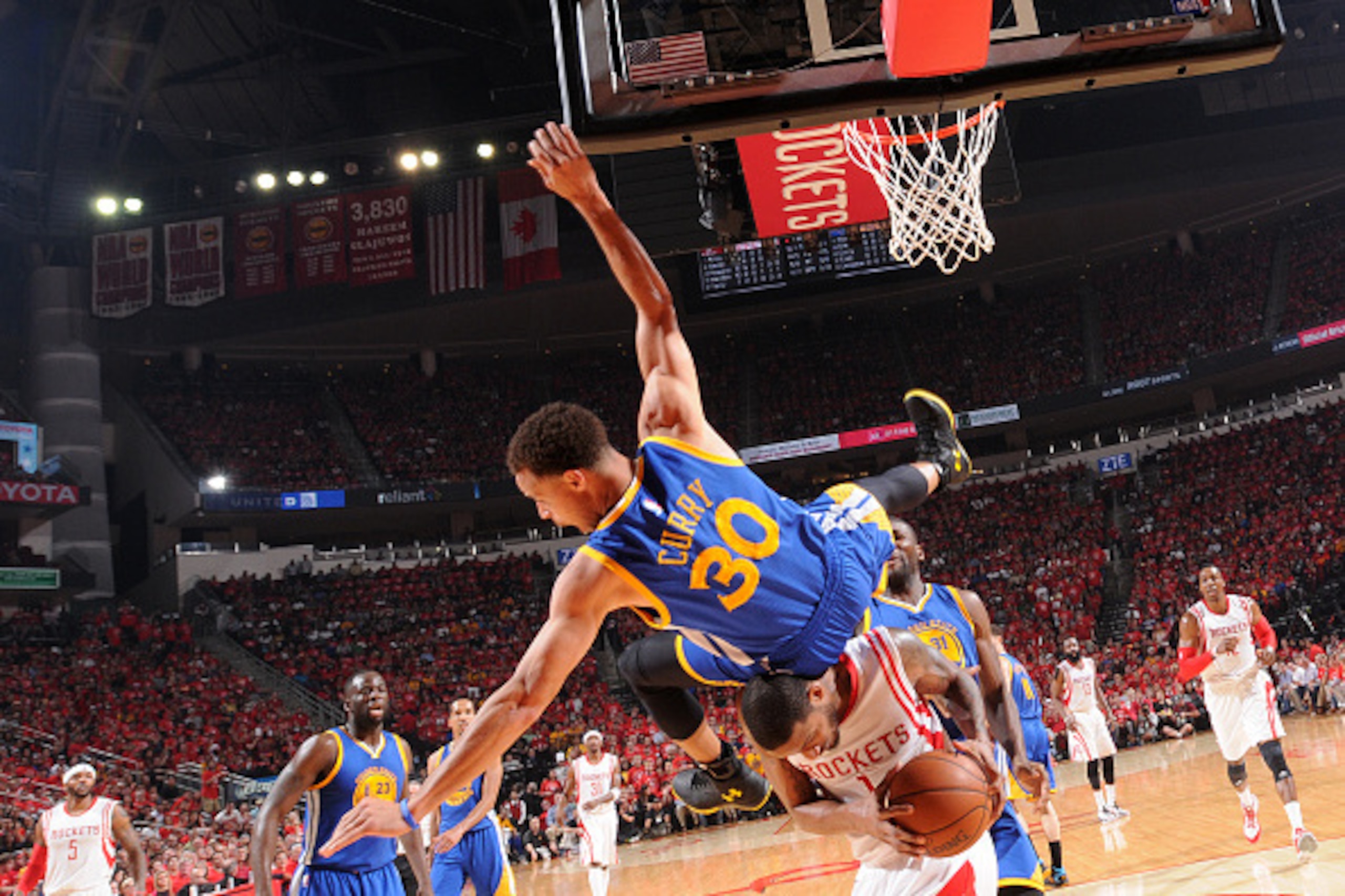HOUSTON, TX - MAY 25:  Stephen Curry #30 of the Golden State Warriors goes up to block a shot and takes a hard fall against the Houston Rockets during the Western Conference Finals during the 2015 NBA Playoffs on May 25, 2015 at the Toyota Center in Houst