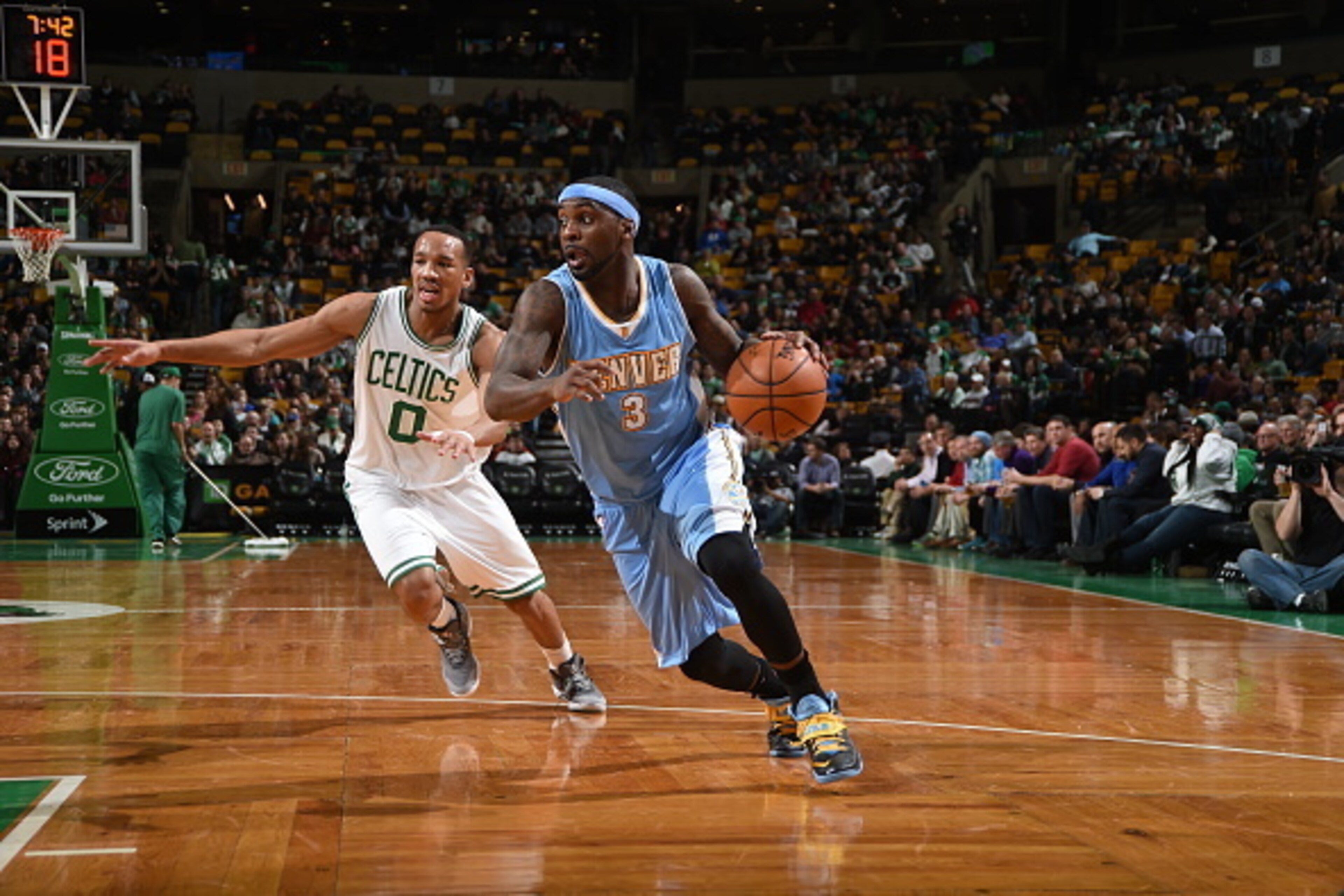 BOSTON, MA - FEBRUARY 4:  Ty Lawson #3 of the Denver Nuggets drives to the basket against Avery Bradley #0 of the Boston Celtics on February 4, 2015 at TD Garden in Boston, Massachusetts.  NOTE TO USER: User expressly acknowledges and agrees that, by down