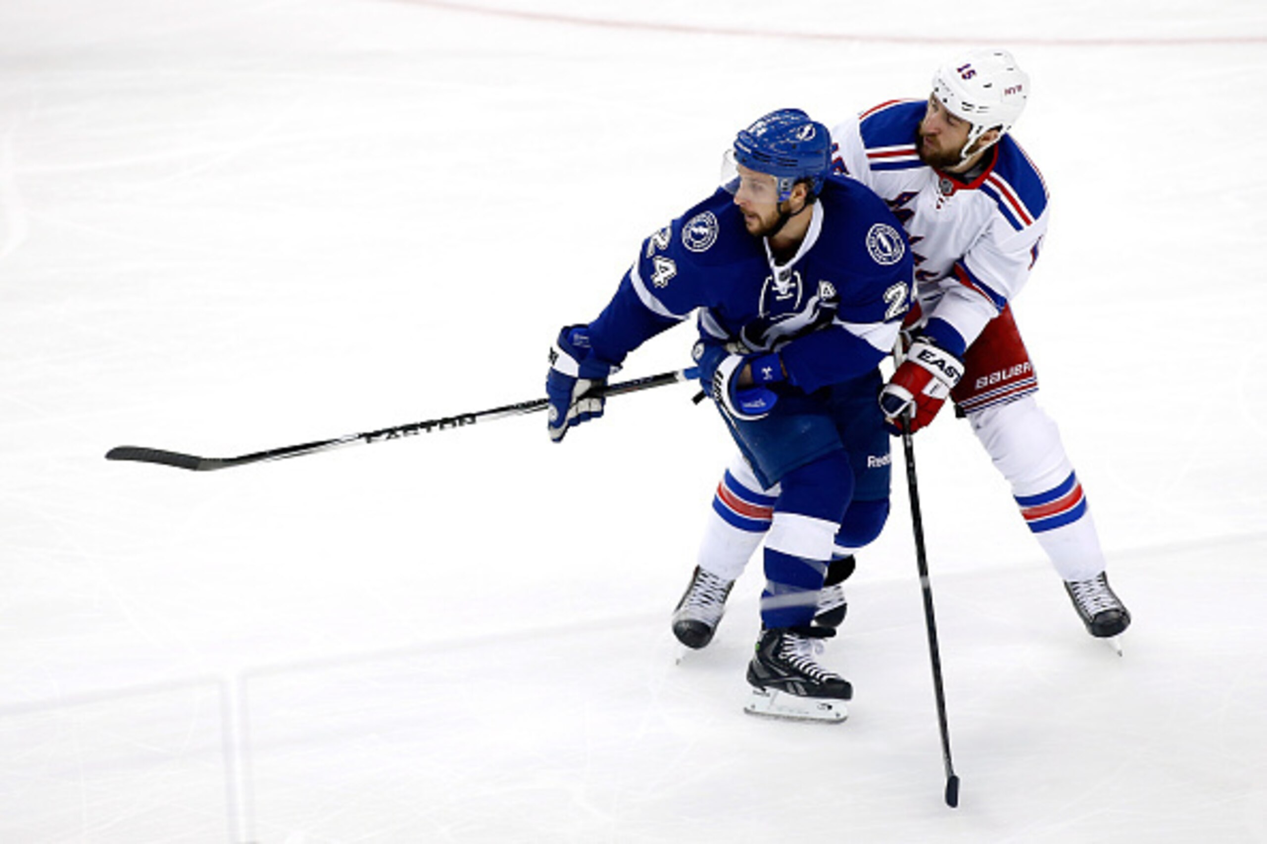 TAMPA, FL - MAY 26:  Ryan Callahan #24 of the Tampa Bay Lightning skates for the puck against Tanner Glass #15 of the New York Rangers in Game Six of the Eastern Conference Finals during the 2015 NHL Stanley Cup Playoffs at Amalie Arena on May 26, 2015 in