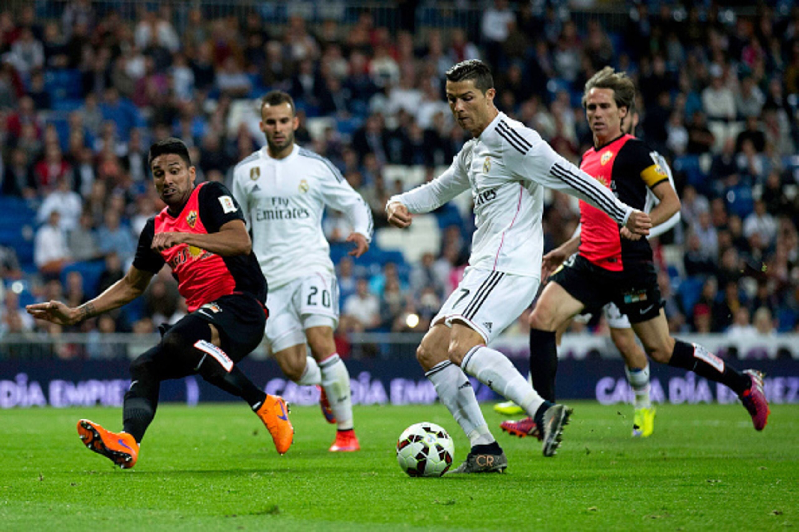 MADRID, SPAIN - APRIL 29:  Cristiano Ronaldo (R) of Real Madrid CF competes for the ball with Mauro Javier Dos Santos (L) of Almeria UD during the La Liga match between Real Madrid CF and UD Almeria at Estadio Santiago Bernabeu on April 29, 2015 in Madrid