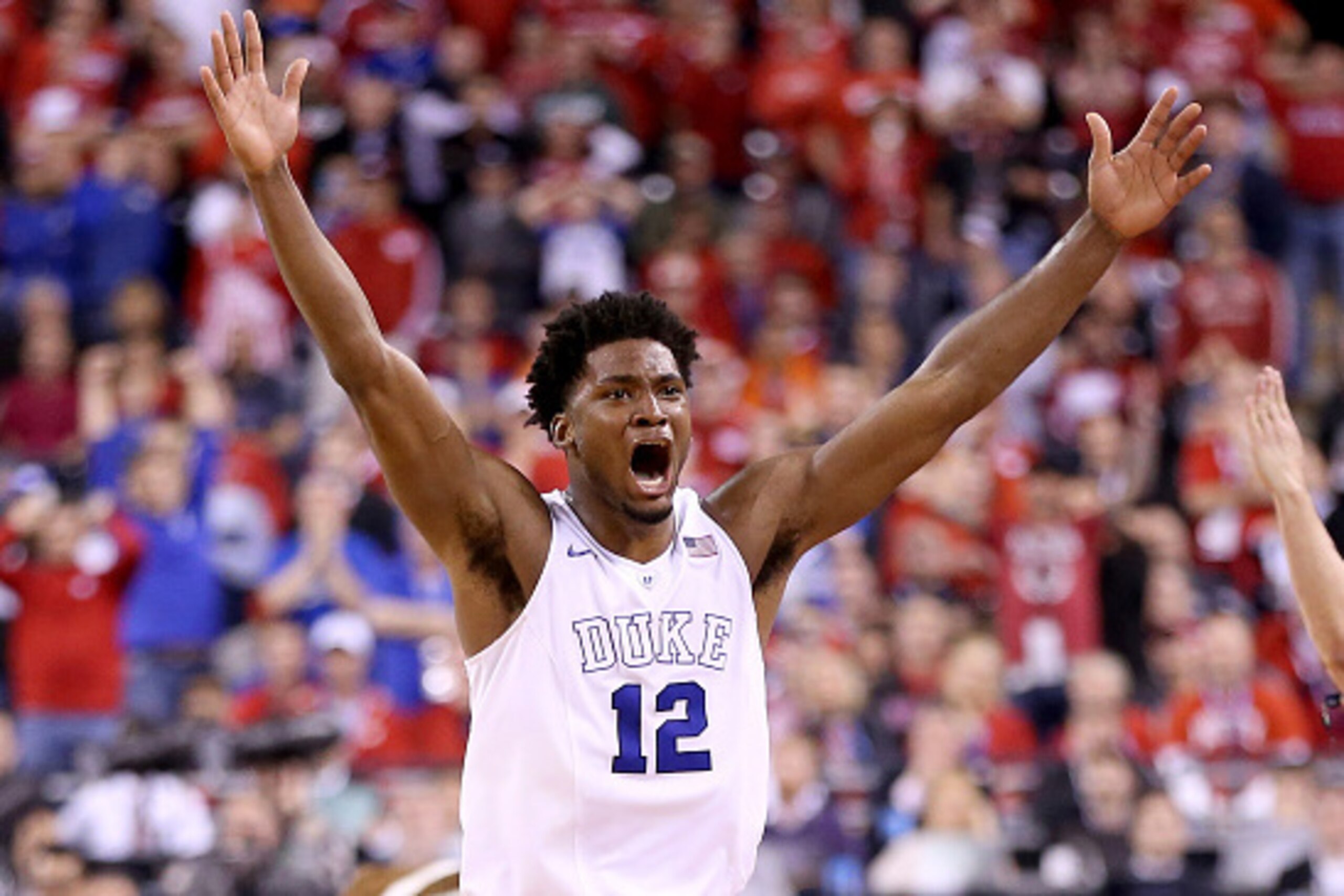 INDIANAPOLIS, IN - APRIL 06: Justise Winslow #12 of the Duke Blue Devils celebrates after defeating the Wisconsin Badgers during the NCAA Men's Final Four National Championship at Lucas Oil Stadium on April 6, 2015 in Indianapolis, Indiana. Duke defeated 