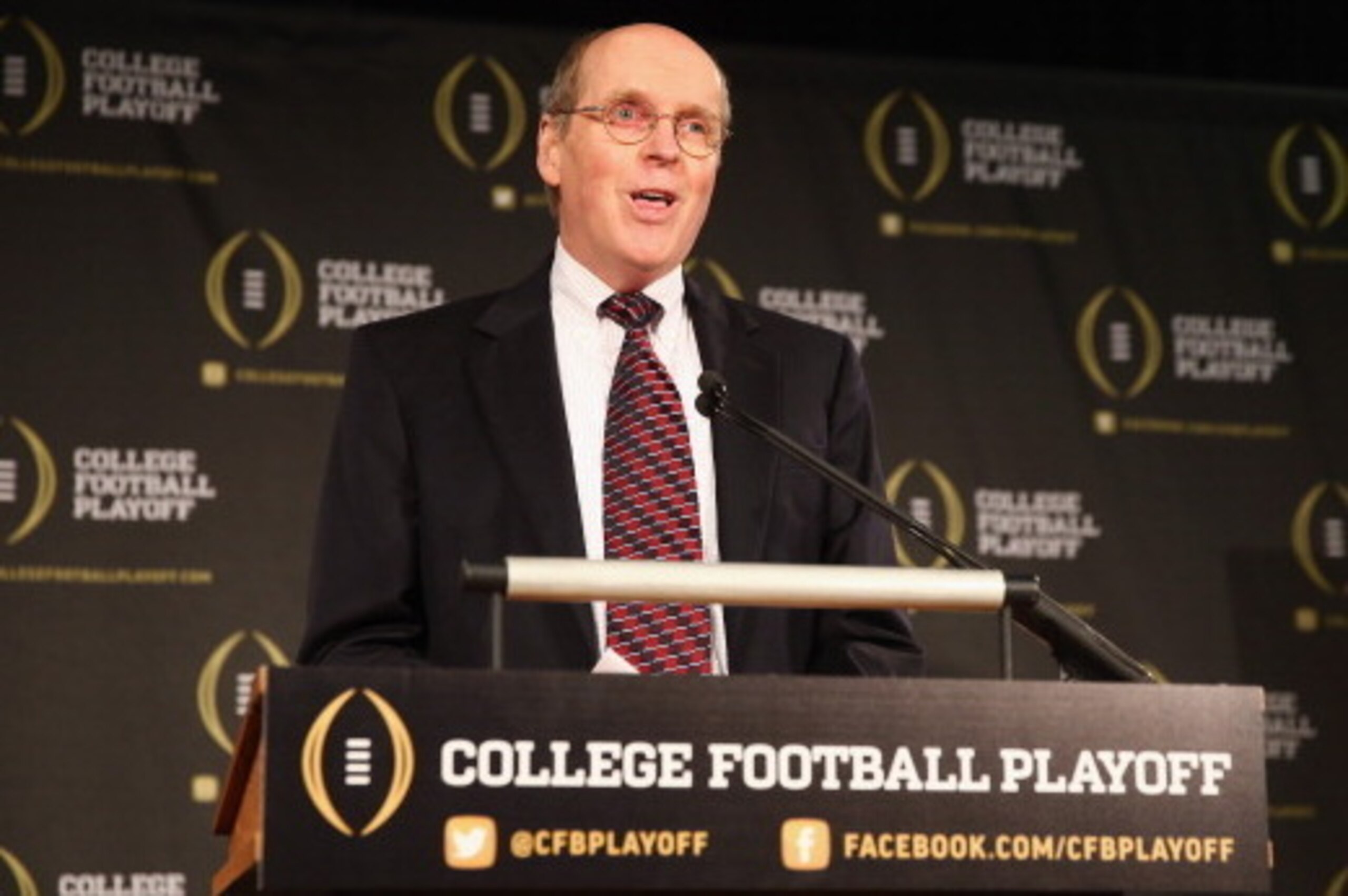 IRVING, TX - OCTOBER 16:  Bill Hancock, executive director of the College Football Playoff, announces the members of the College Football Playoff selection committee on October 16, 2013 in Irving, Texas. Condoleezza Rice, Stanford University professor and