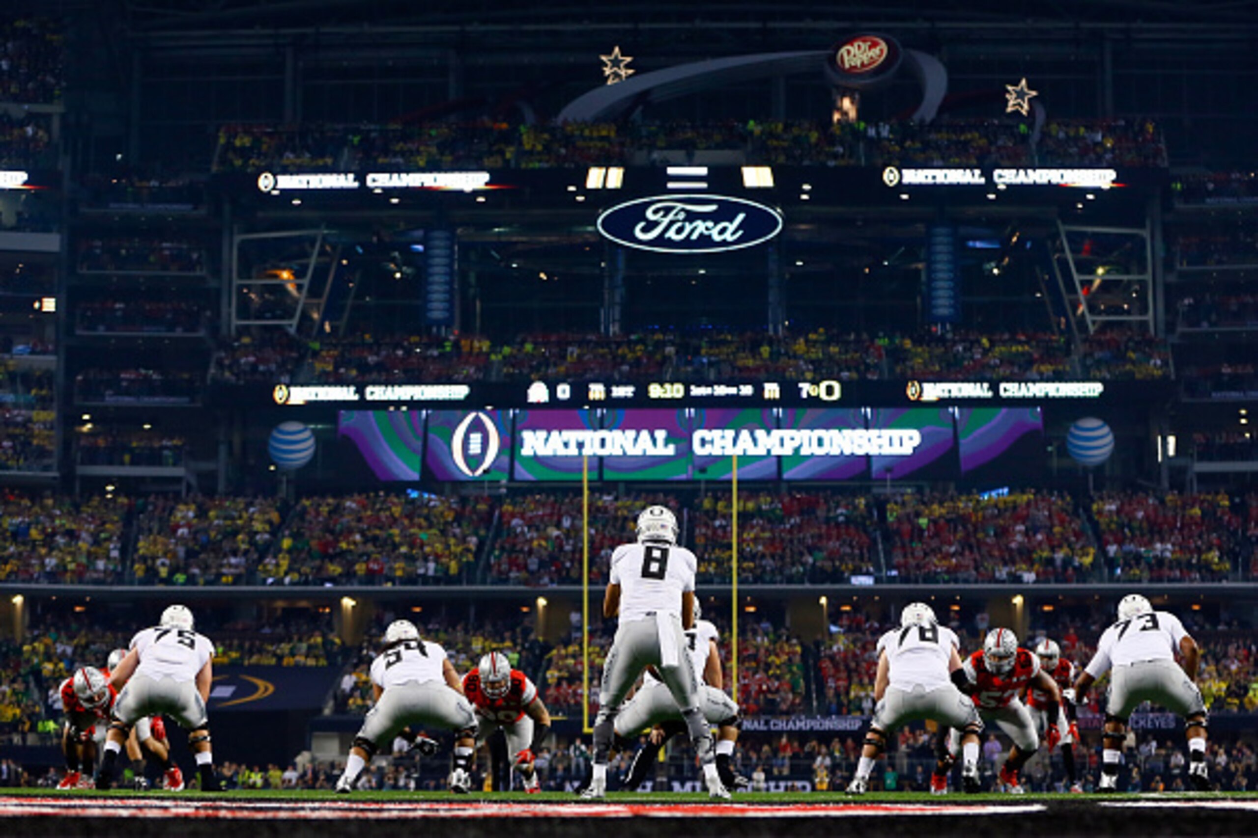 ARLINGTON, TX - JANUARY 12:  Quarterback Marcus Mariota #8 of the Oregon Ducks under center against the Ohio State Buckeyes during the College Football Playoff National Championship Game at AT&T Stadium on January 12, 2015 in Arlington, Texas.  (Photo by 