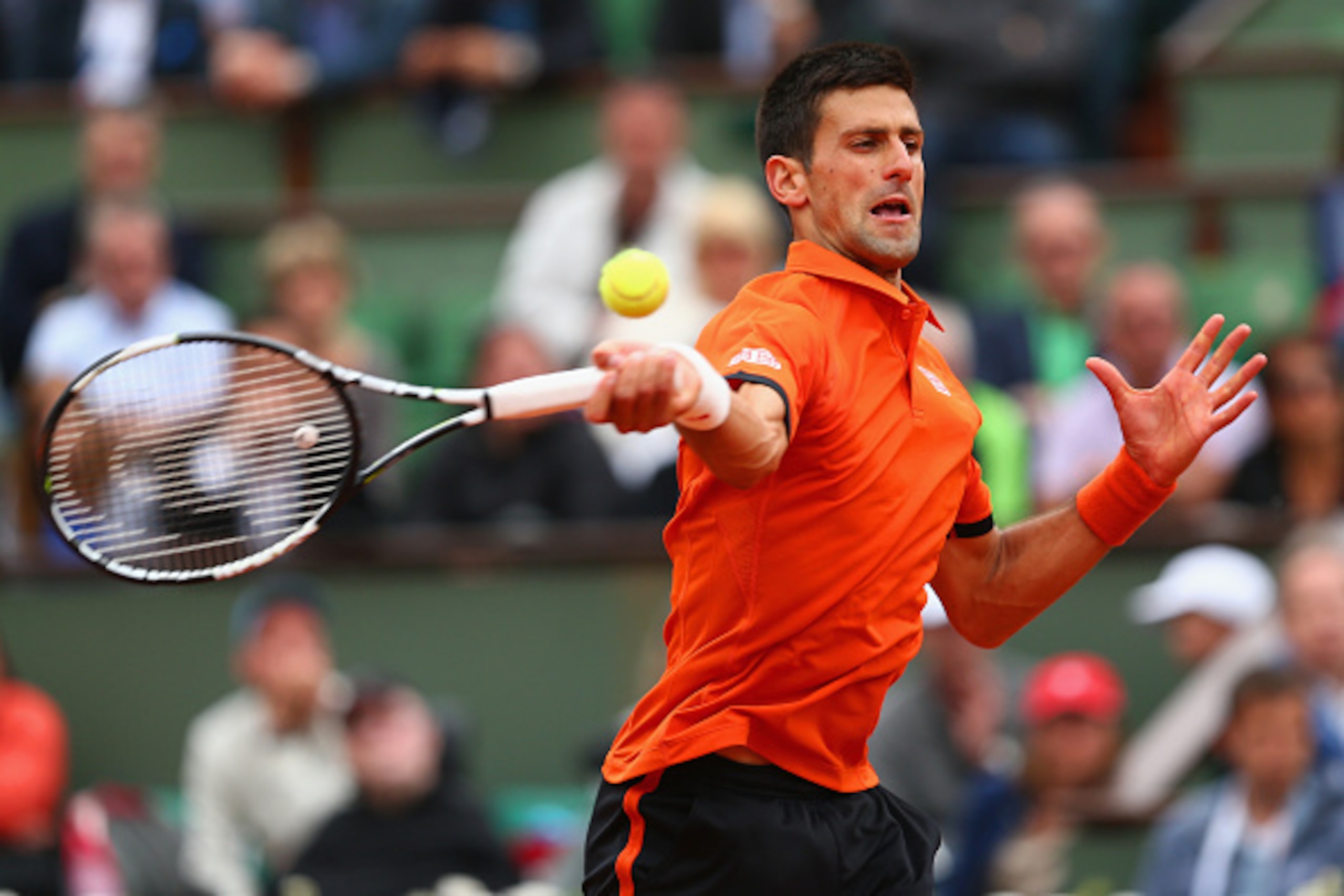 PARIS, FRANCE - MAY 26:  Novak Djokovic of Serbia plays a forehand during his Men's Singles match against Jarkko Nieminen of Finland on day three of the 2015 French Open at Roland Garros on May 26, 2015 in Paris, France.  (Photo by Clive Brunskill/Getty I