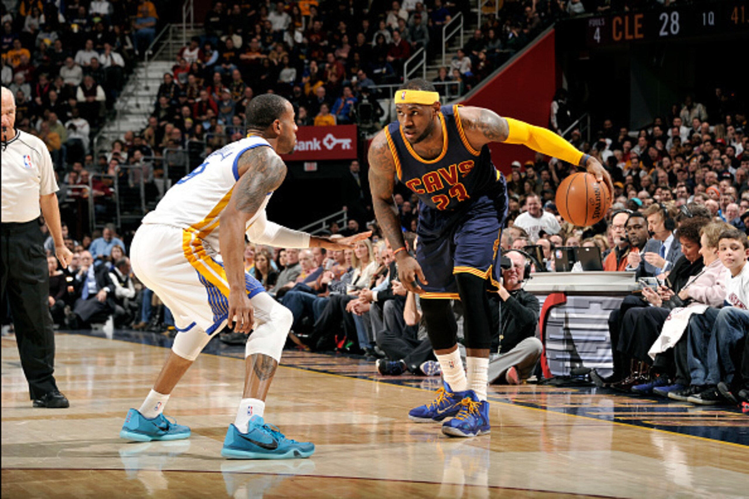 CLEVELAND, OH - FEBRUARY 26: LeBron James #23 of the Cleveland Cavaliers handles the ball against Andre Iguodala #9 of the Golden State Warriors at The Quicken Loans Arena on February 26, 2015 in Cleveland, Ohio. NOTE TO USER: User expressly acknowledges 