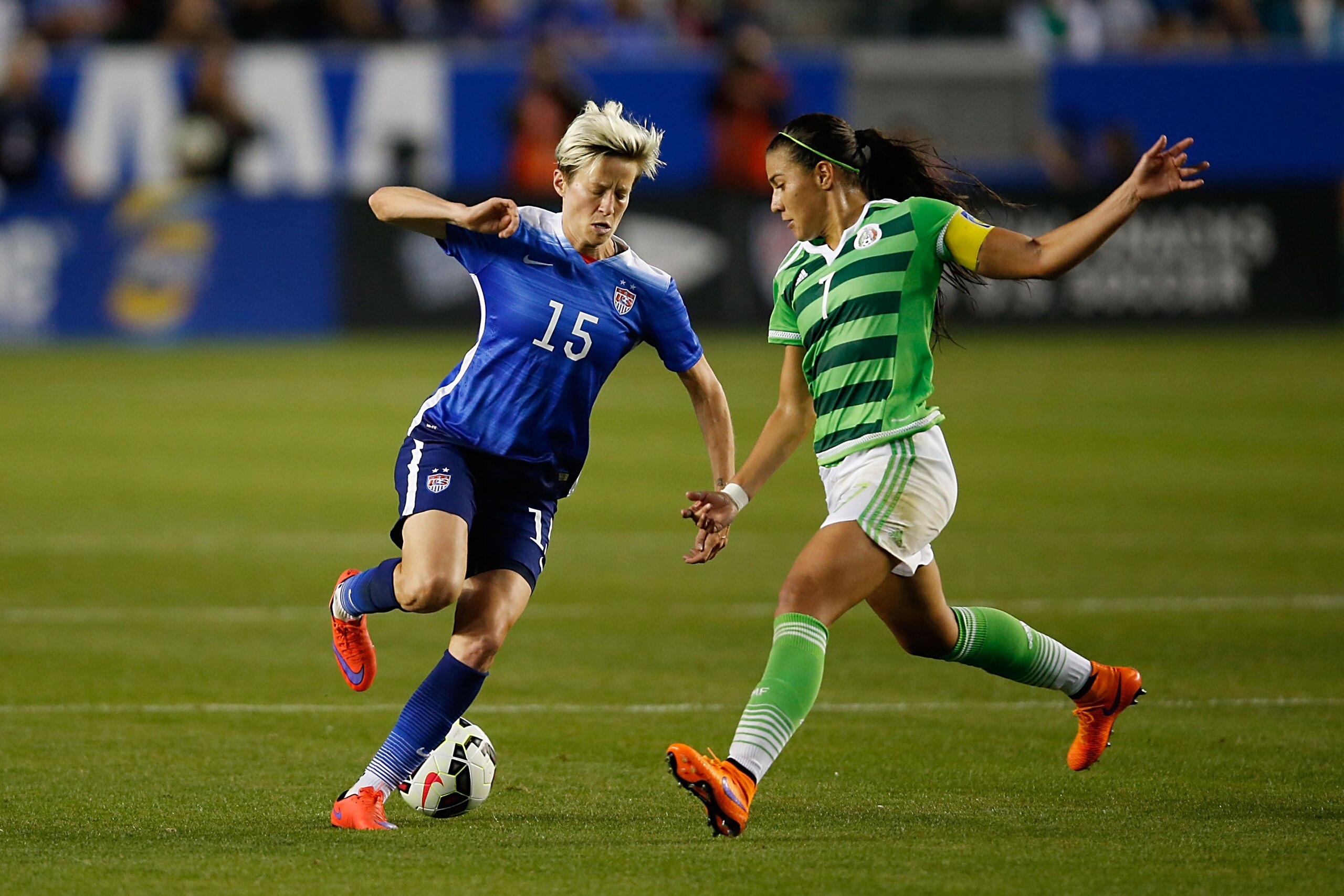 LOS ANGELES, CA - MAY 17: Midfielder Megan Rapinoe #15 of USA passes the ball behind her back past Midfielder Neyeli Rangel #7 of Mexico in the second half during their international friendly match at StubHub Center on May 17, 2015 in Los Angeles, Califo LOS ANGELES, CA - MAY 17: Midfielder Megan Rapinoe #15 of USA passes the ball behind her back past Midfielder Neyeli Rangel #7 of Mexico in the second half during their international friendly match at StubHub Center on May 17, 2015 in Los Angeles, Califo