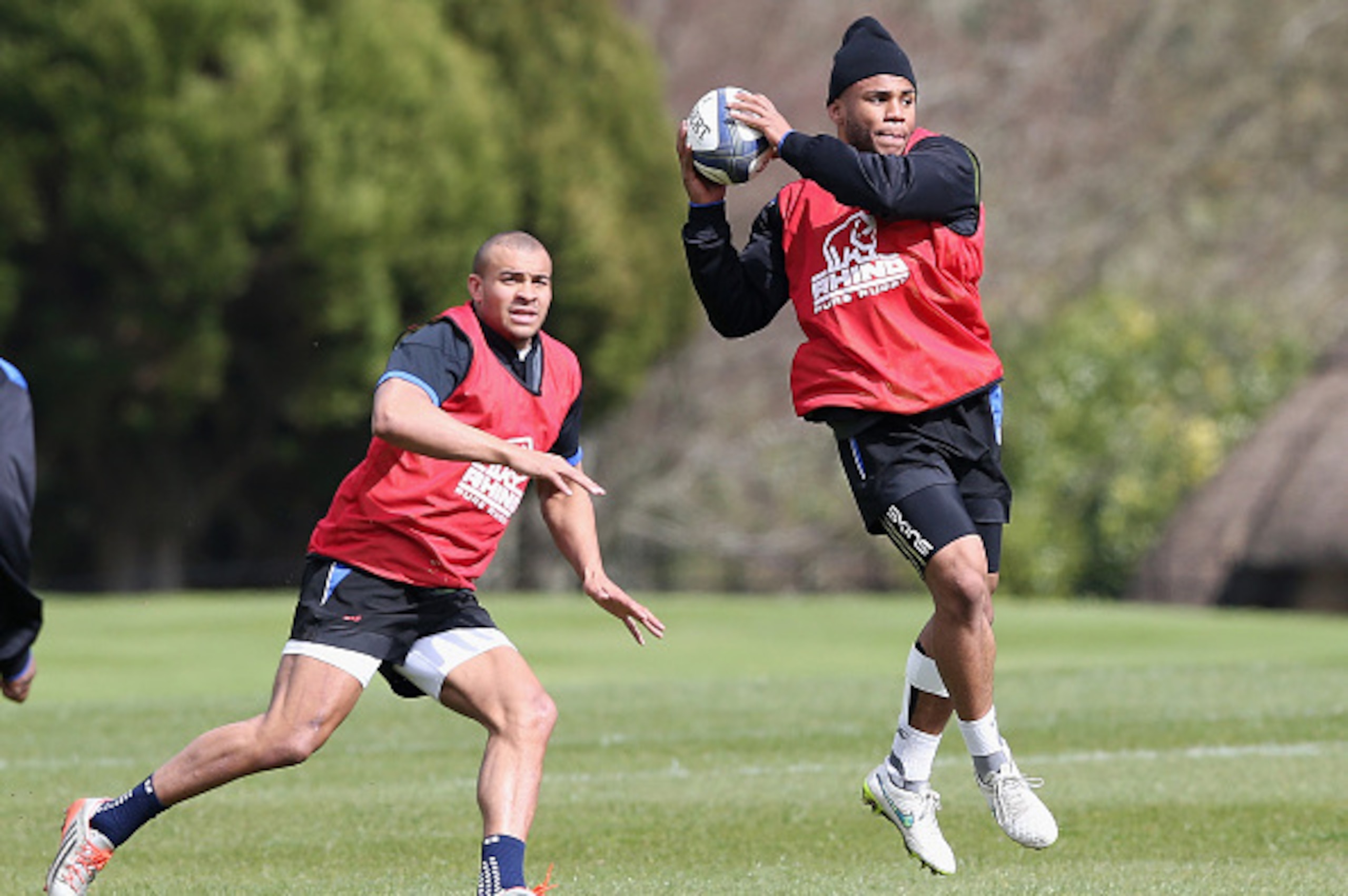 BATH, ENGLAND - MARCH 31:  Kyle Eastmond catches the ball as Jonathan Joseph looks on during the Bath training session held at Farleigh House on March 31, 2015 in Bath, England.  (Photo by David Rogers/Getty Images)