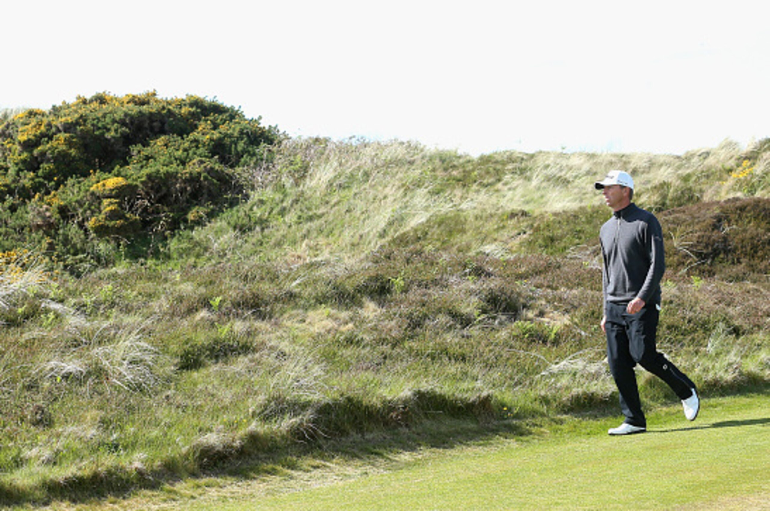NEWCASTLE, NORTHERN IRELAND - MAY 28:  Soren Hansen of Denmark walks down the 5th hole during the First Round of the Dubai Duty Free Irish Open Hosted by the Rory Foundation at Royal County Down Golf Club on May 28, 2015 in Newcastle, Northern Ireland.  (