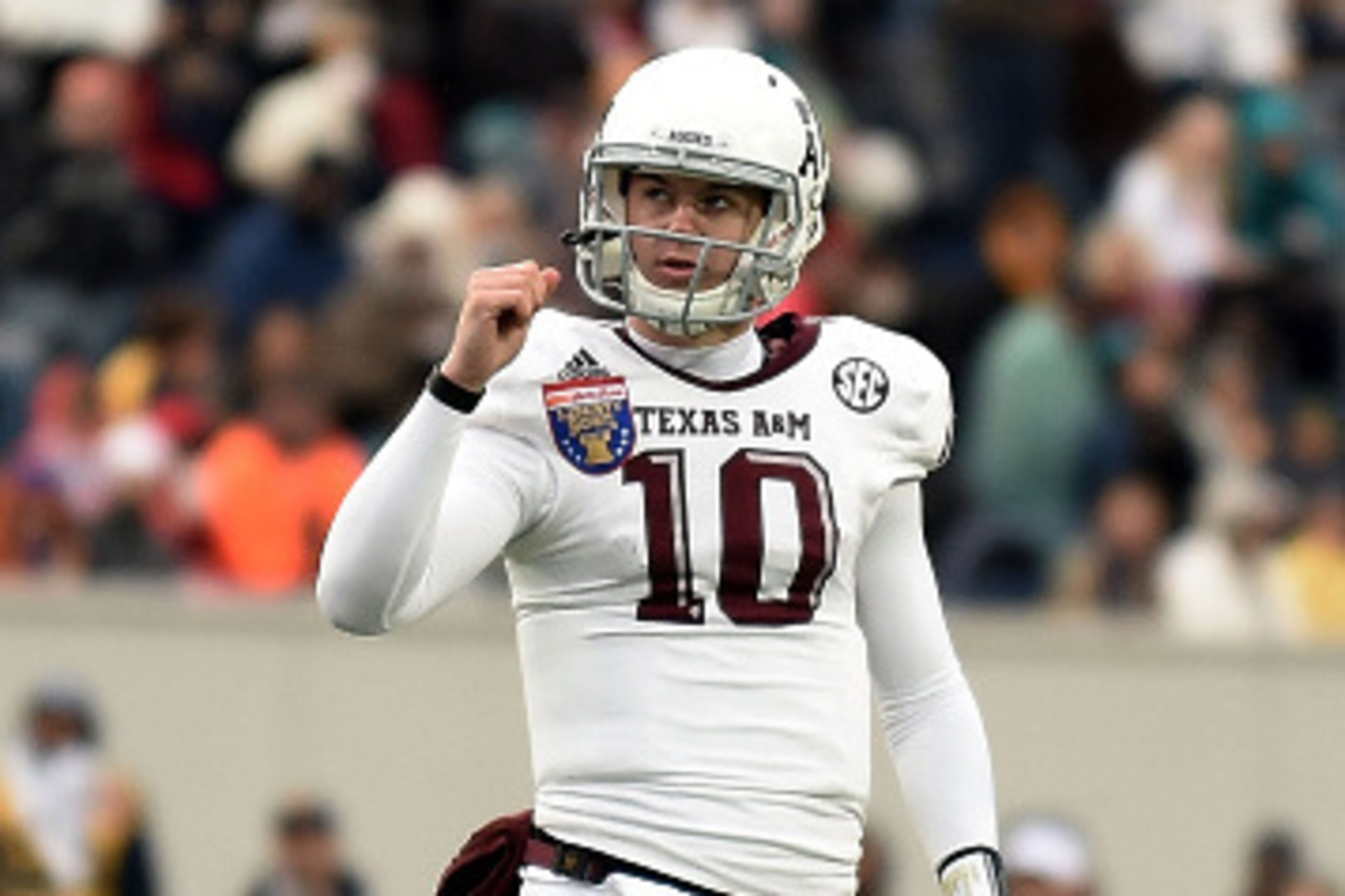 MEMPHIS, TN - DECEMBER 29:  Kyle Allen #10 of the Texas A&M Aggies reacts to a touchdown against the West Virginia Mountaineers during the third quarter of the 56th annual Autozone Liberty Bowl at Liberty Bowl Memorial Stadium on December 29, 2014 in Memp