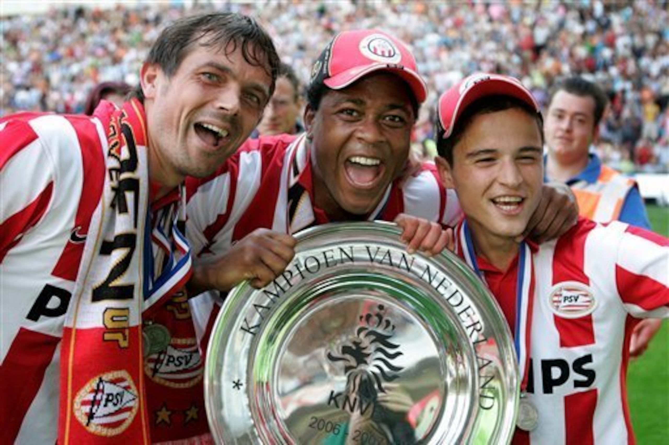 Cocu celebrates with Patrick Kluivert and Ibrahim Afellay