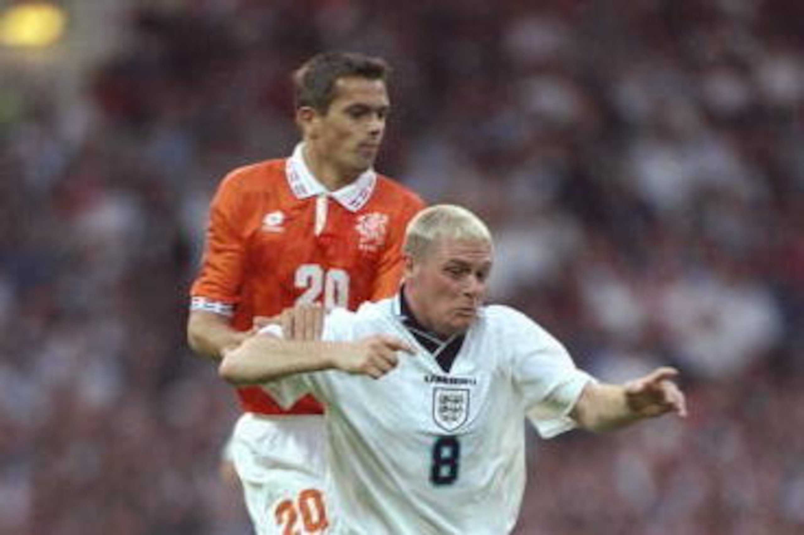 18 Jun 1996:  Paul Gascoigne of England is challenged by Philip Cocu of Holland in the Group A match at Wembley during the European Football Championships. England beat Holland 4-1.