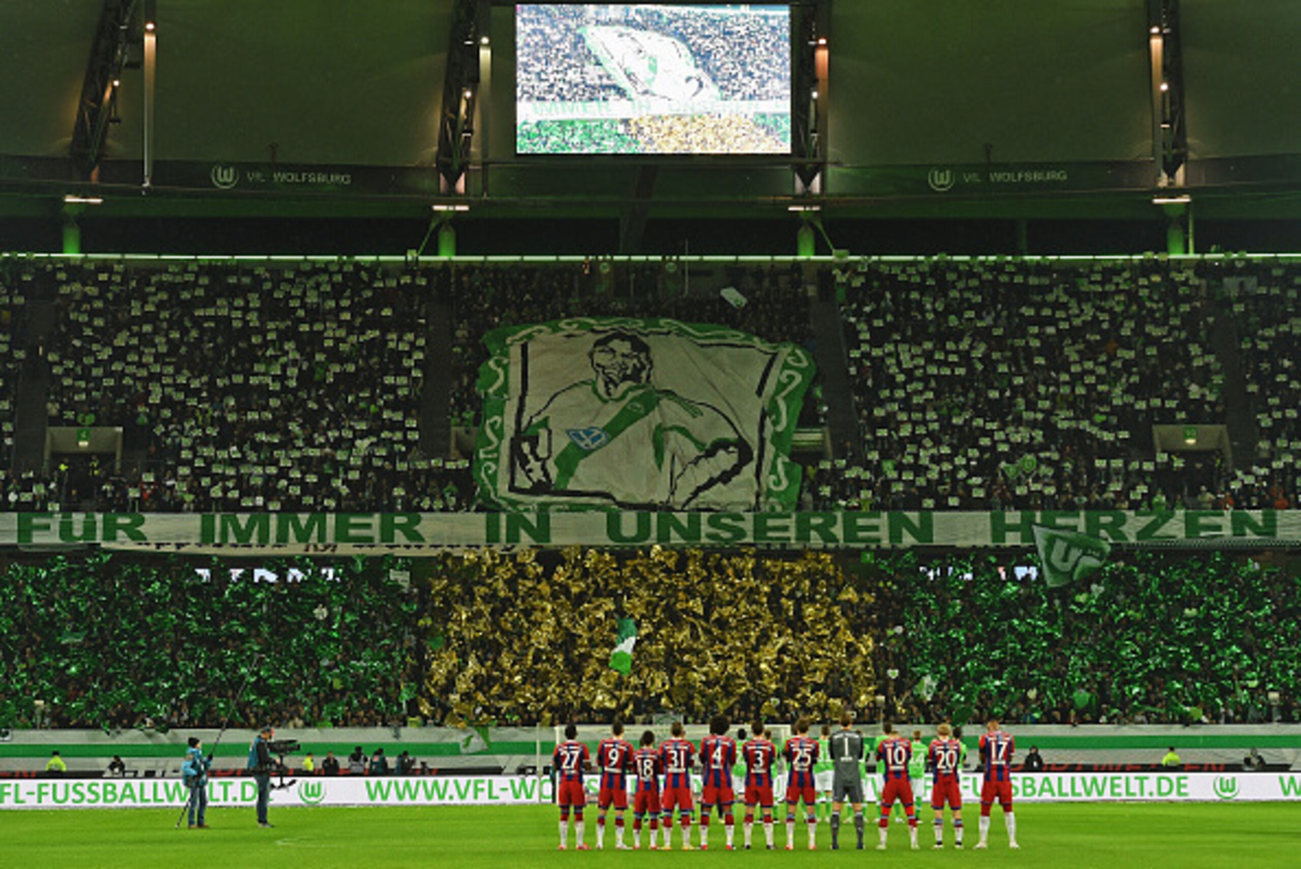 WOLFSBURG, GERMANY - JANUARY 30:  Fans and players remember former Wolfsburg player Junior Malanda, recently died in a car crash, prior to the Bundesliga match between VfL Wolfsburg and FC Bayern Muenchen at Volkswagen Arena on January 30, 2015 in Wolfsbu