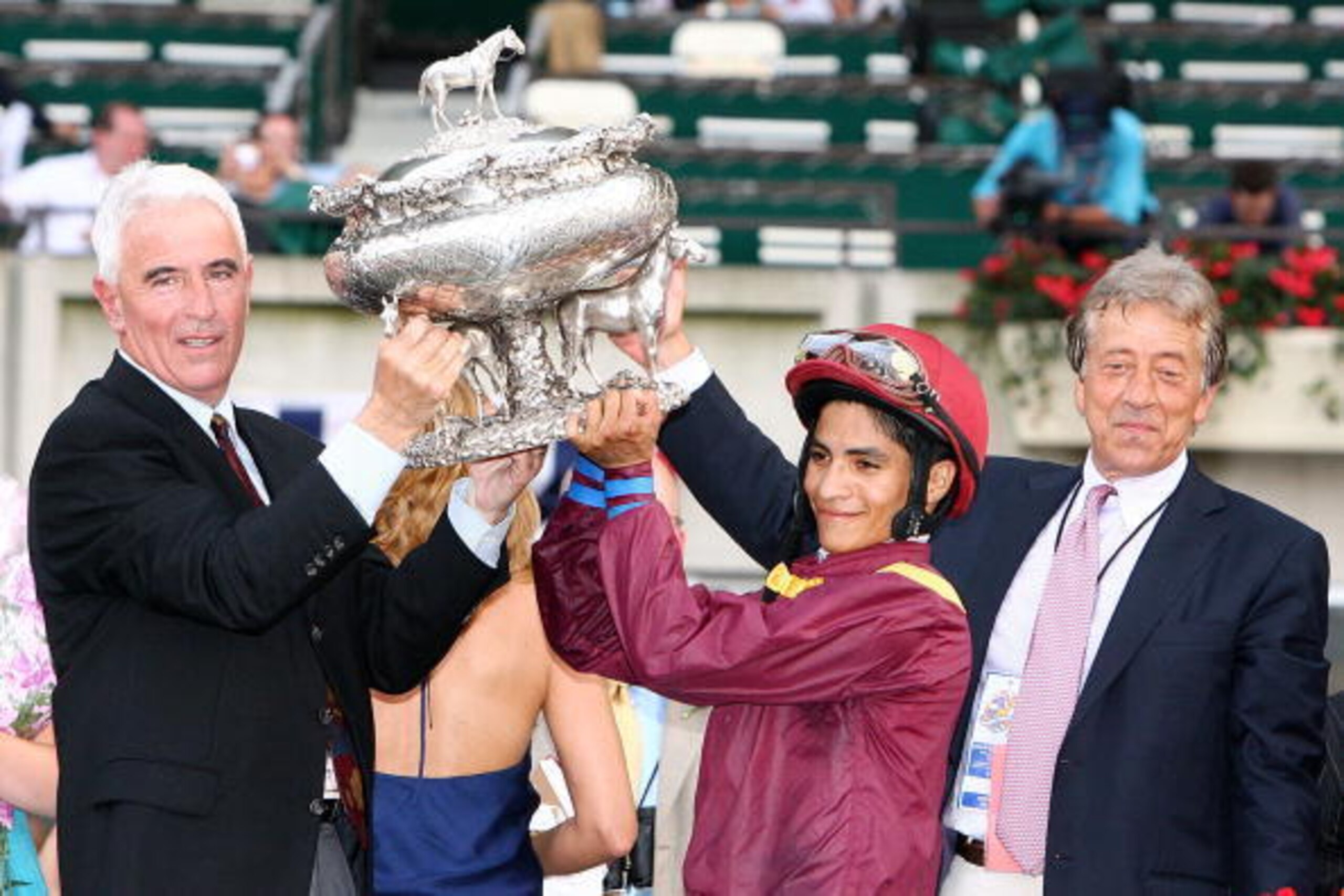 ELMONT, NY - JUNE 07: Alan Garcia who rode atop Da'Tara (C) holds the trophy alongside Trainer Nick Zito (L) and Owner Robert LaPenta (R) after winning the 140th running of the Belmont Stakes at Belmont Park on June 7, 2008 in Elmont, New York. (Photo b ELMONT, NY - JUNE 07: Alan Garcia who rode atop Da'Tara (C) holds the trophy alongside Trainer Nick Zito (L) and Owner Robert LaPenta (R) after winning the 140th running of the Belmont Stakes at Belmont Park on June 7, 2008 in Elmont, New York. (Photo b