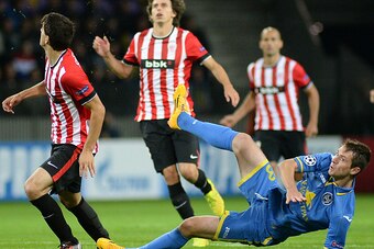 BORISOV,BELARUS - SEPTEMBER 30: Nikolai Signevich of Bate Borisov (Blue Strip) in action during the UEFA Champions League Group H match between Bate Borisov and Athletic Bilbao at the Borisov Arena on September 30, 2014 in Borisov, Belarus. (Photo by Maxi