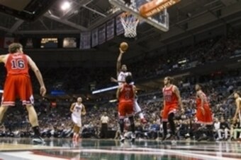 Apr 30, 2015; Milwaukee, WI, USA; Milwaukee Bucks guard Khris Middleton (22) shoots over Chicago Bulls guard Derrick Rose (1) during the third quarter in game six of the first round of the NBA Playoffs. at BMO Harris Bradley Center. Mandatory Credit: Jeff