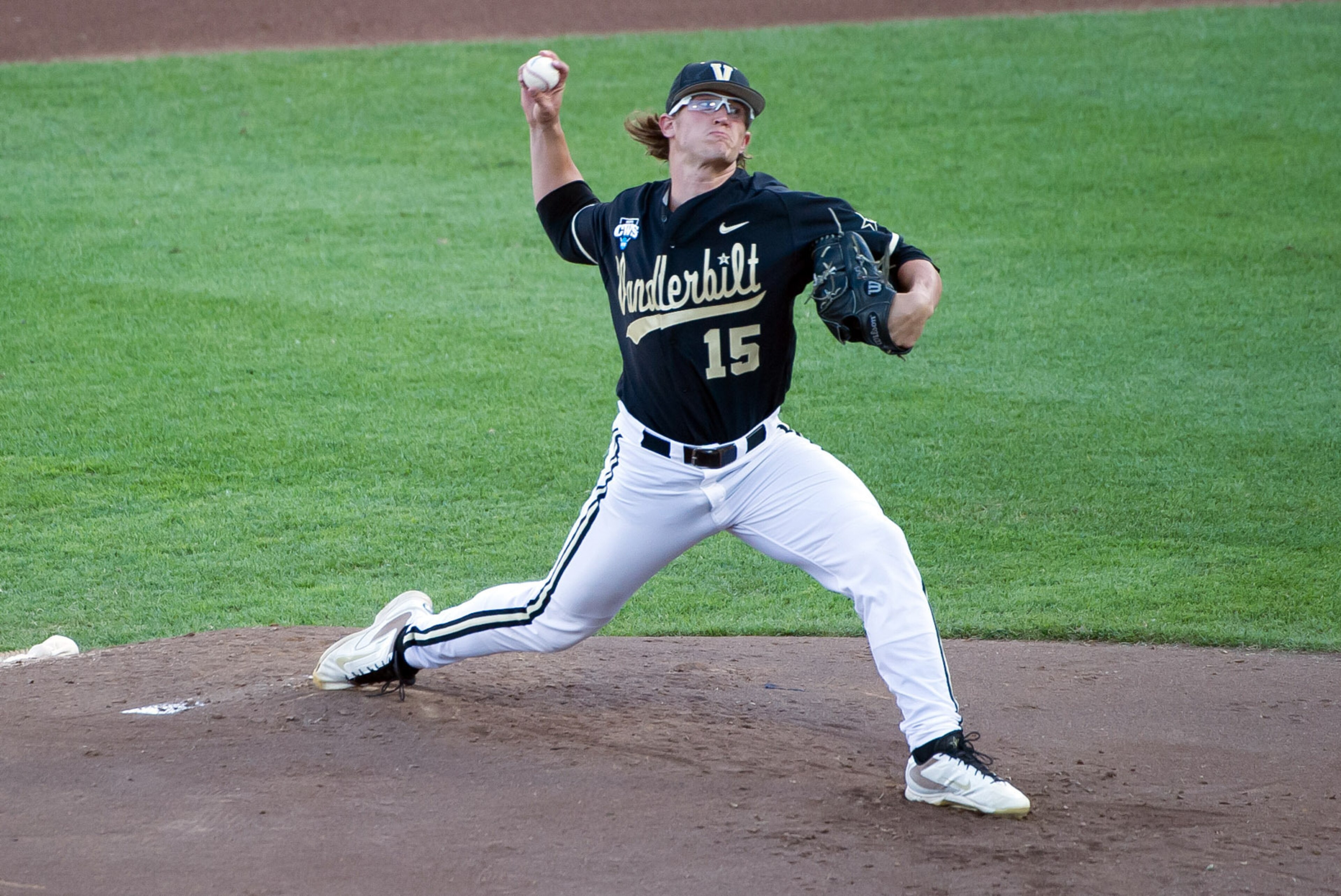 Jun 25, 2014; Omaha, NE, USA; Vanderbilt Commodores pitcher Carson Fulmer (15) pitches against the Virginia Cavaliers during game three of the College World Series Finals at TD Ameritrade Park Omaha. Mandatory Credit: Steven Branscombe-USA TODAY Sports