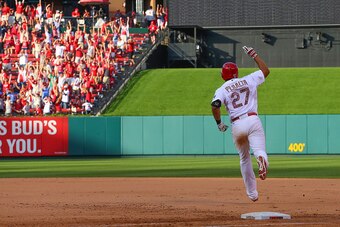 ST. LOUIS, MO - MAY 25: Jhonny Peralta #27 of the St. Louis Cardinals rounds first base after hitting a walk-off solo home run against Arizona Diamondbacks in the tenth inning at Busch Stadium on May 25, 2015 in St. Louis, Missouri.  (Photo by Dilip Vishw