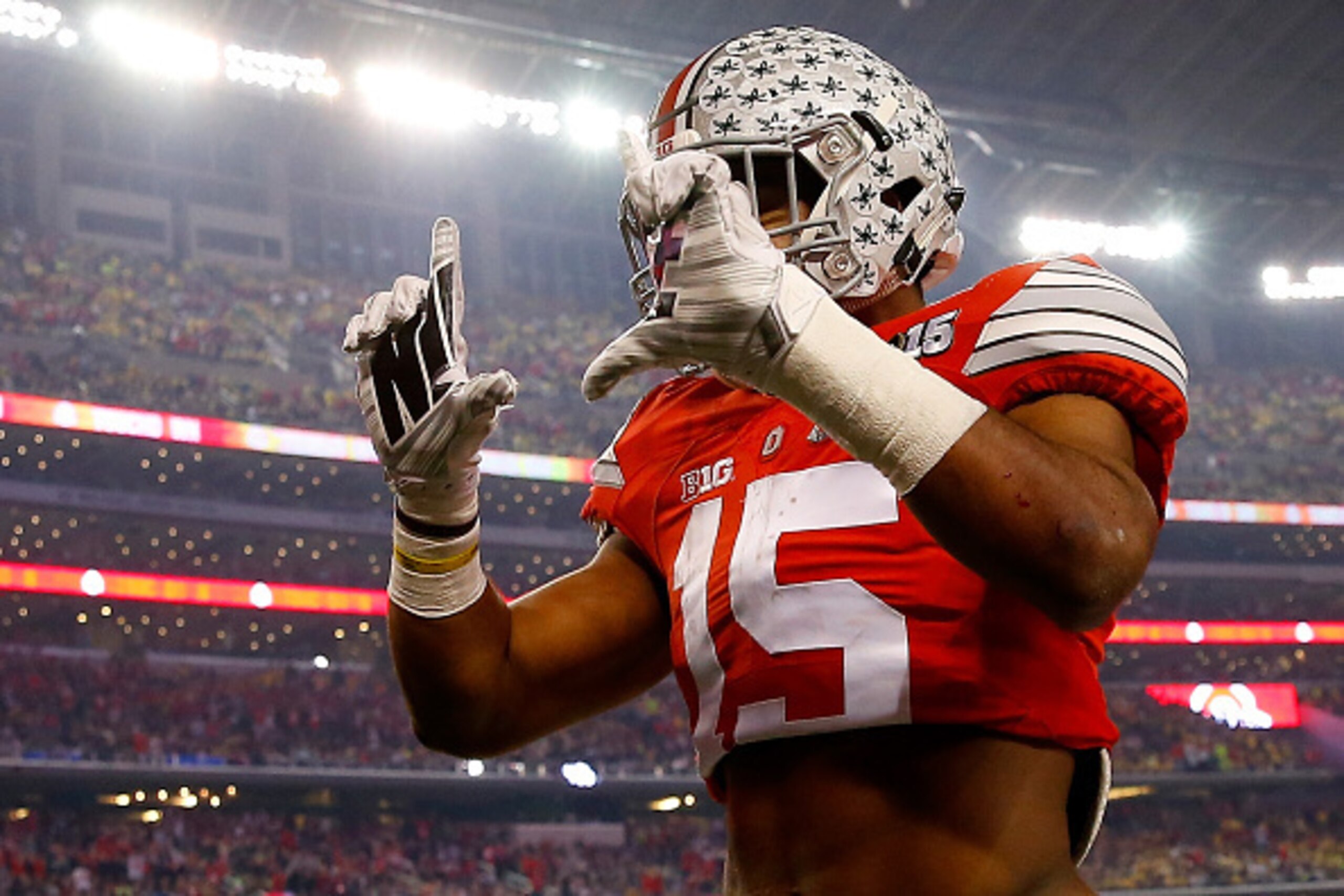 ARLINGTON, TX - JANUARY 12: Running back Ezekiel Elliott #15 of the Ohio State Buckeyes celebrates after scoring a 33 yard touchdown in the first quarter against the Oregon Ducks during the College Football Playoff National Championship Game at AT&T Stad ARLINGTON, TX - JANUARY 12: Running back Ezekiel Elliott #15 of the Ohio State Buckeyes celebrates after scoring a 33 yard touchdown in the first quarter against the Oregon Ducks during the College Football Playoff National Championship Game at AT&T Stad