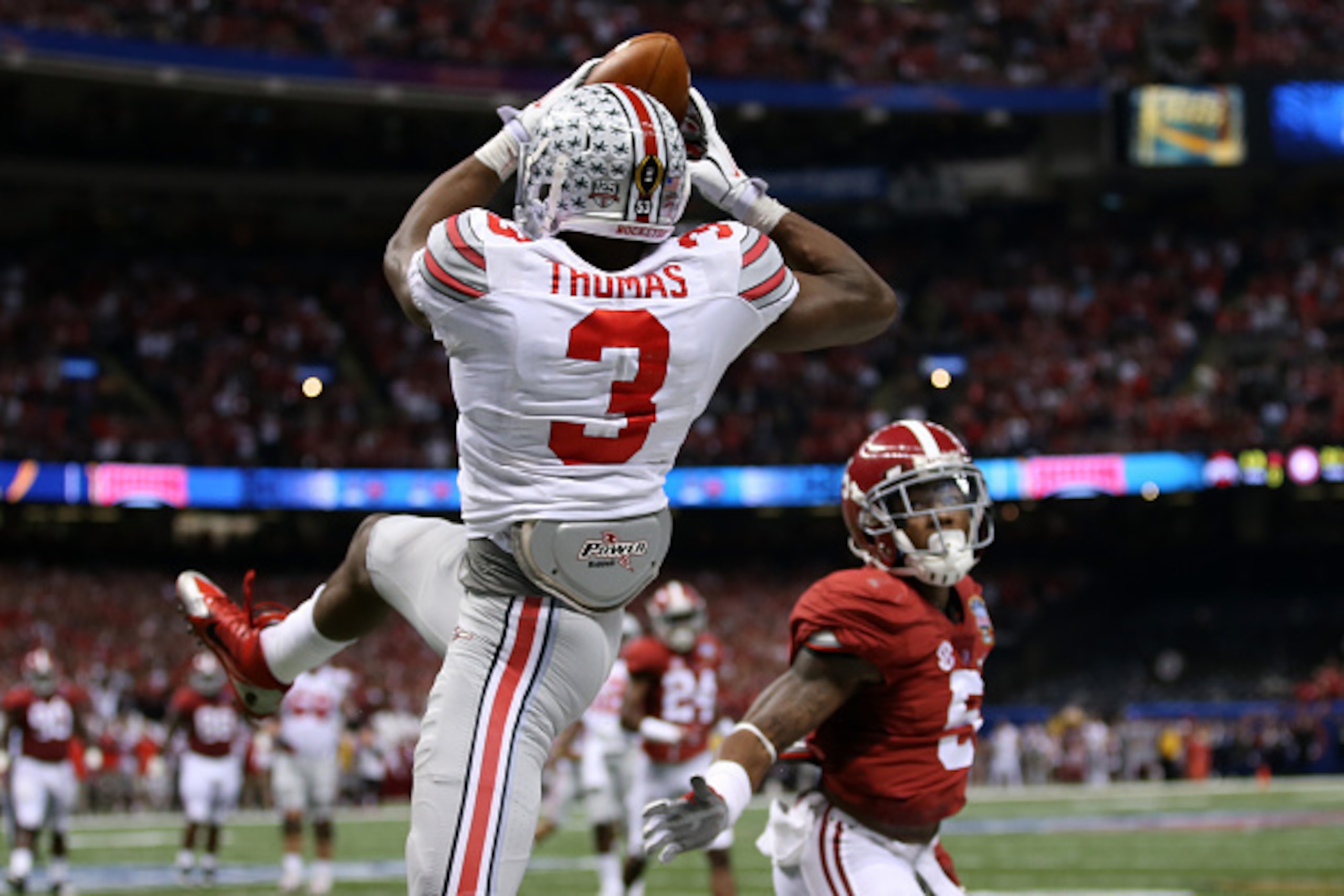 NEW ORLEANS, LA - JANUARY 01: Michael Thomas #3 of the Ohio State Buckeyes catches a 13 yard touchdown pass late in the second quarter against the Alabama Crimson Tide during the All State Sugar Bowl at the Mercedes-Benz Superdome on January 1, 2015 in N NEW ORLEANS, LA - JANUARY 01: Michael Thomas #3 of the Ohio State Buckeyes catches a 13 yard touchdown pass late in the second quarter against the Alabama Crimson Tide during the All State Sugar Bowl at the Mercedes-Benz Superdome on January 1, 2015 in N