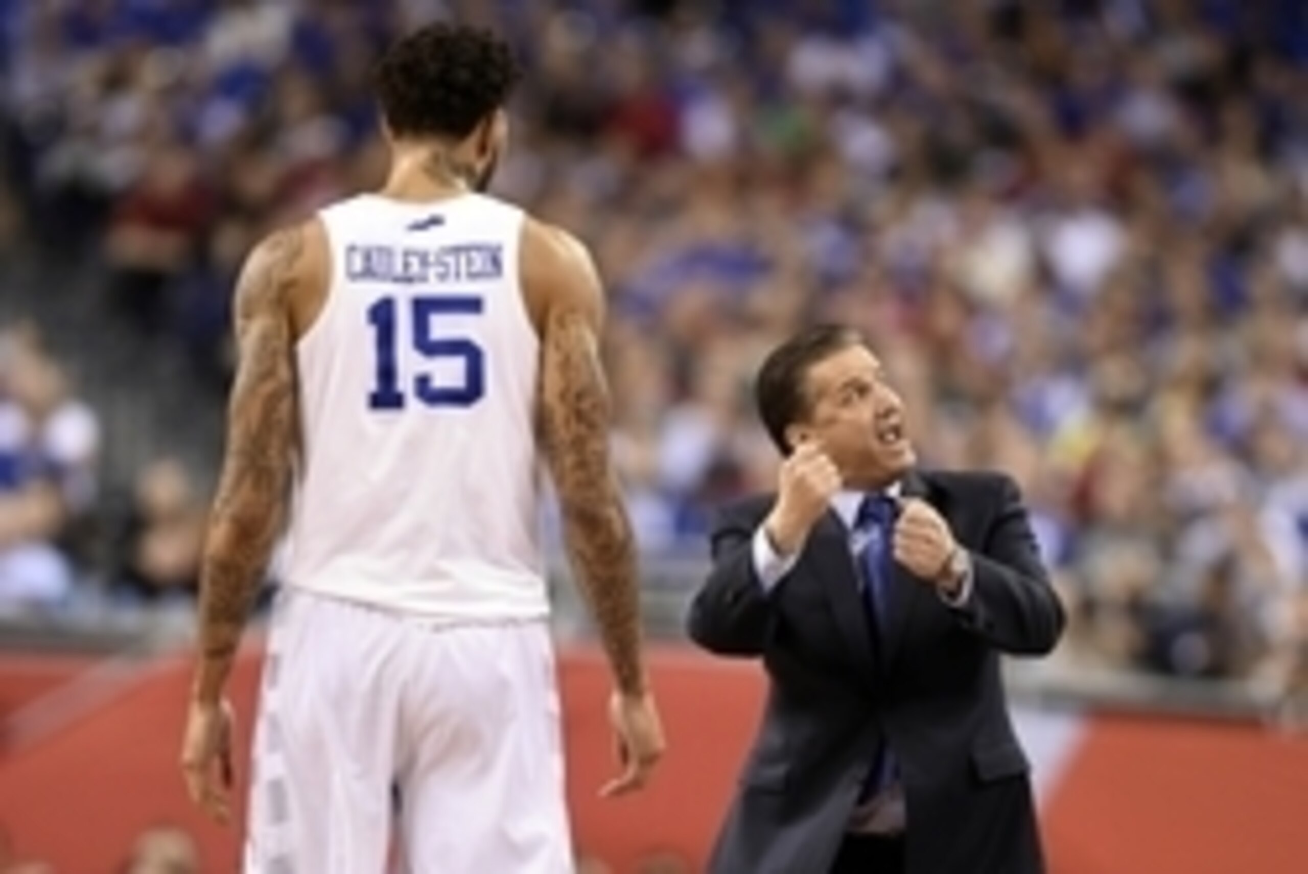 Apr 4, 2015; Indianapolis, IN, USA; Kentucky Wildcats head coach John Calipari (right) gives instruction to forward Willie Cauley-Stein (15) in the first half of the 2015 NCAA Men's Division I Championship semi-final game against the Wisconsin Badgers at Apr 4, 2015; Indianapolis, IN, USA; Kentucky Wildcats head coach John Calipari (right) gives instruction to forward Willie Cauley-Stein (15) in the first half of the 2015 NCAA Men's Division I Championship semi-final game against the Wisconsin Badgers at