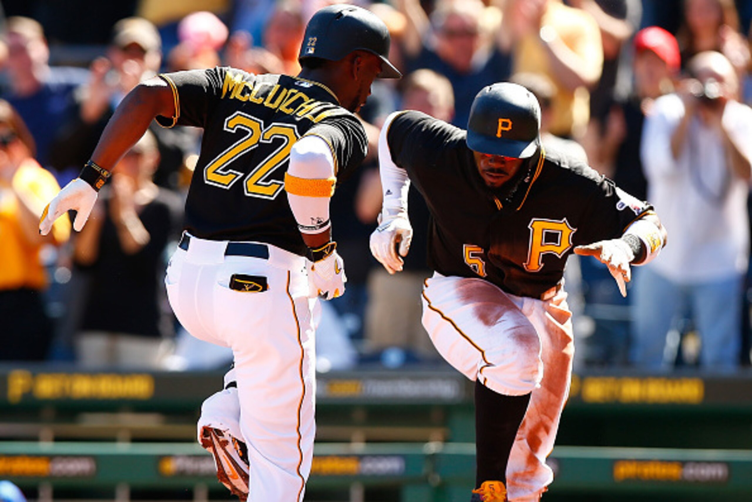 PITTSBURGH, PA - MAY 23:  Andrew McCutchen #22 of the Pittsburgh Pirates celebrates with teammate Josh Harrison #5 after hitting a two-run home run in the first inning against the New York Mets during the game at PNC Park on May 23, 2015 in Pittsburgh, Pe