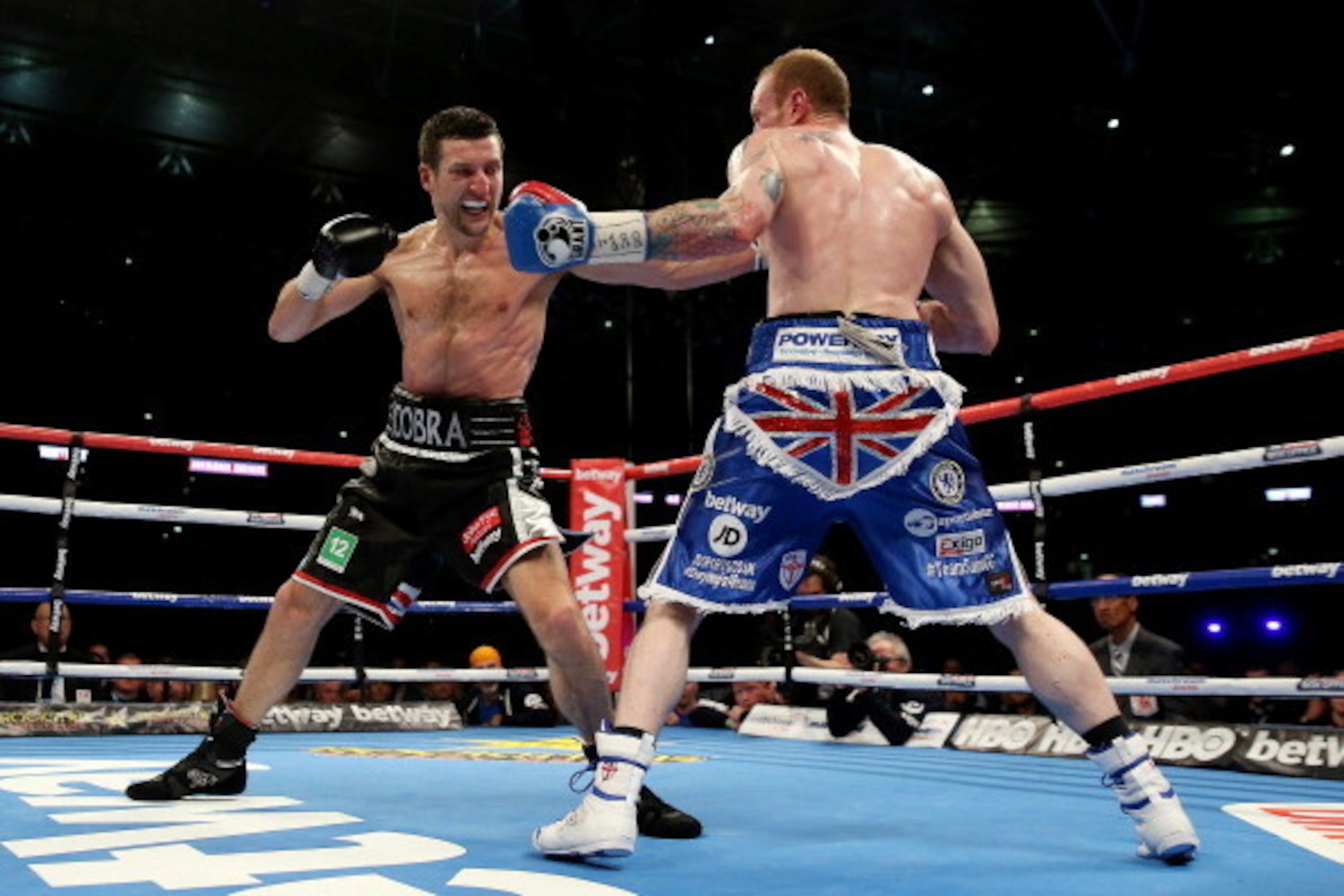 LONDON, ENGLAND - MAY 31:  George Groves in action with Carl Froch in their IBF and WBA World Super Middleweight bout at Wembley Stadium on May 31, 2014 in London, England.  (Photo by Scott Heavey/Getty Images)
