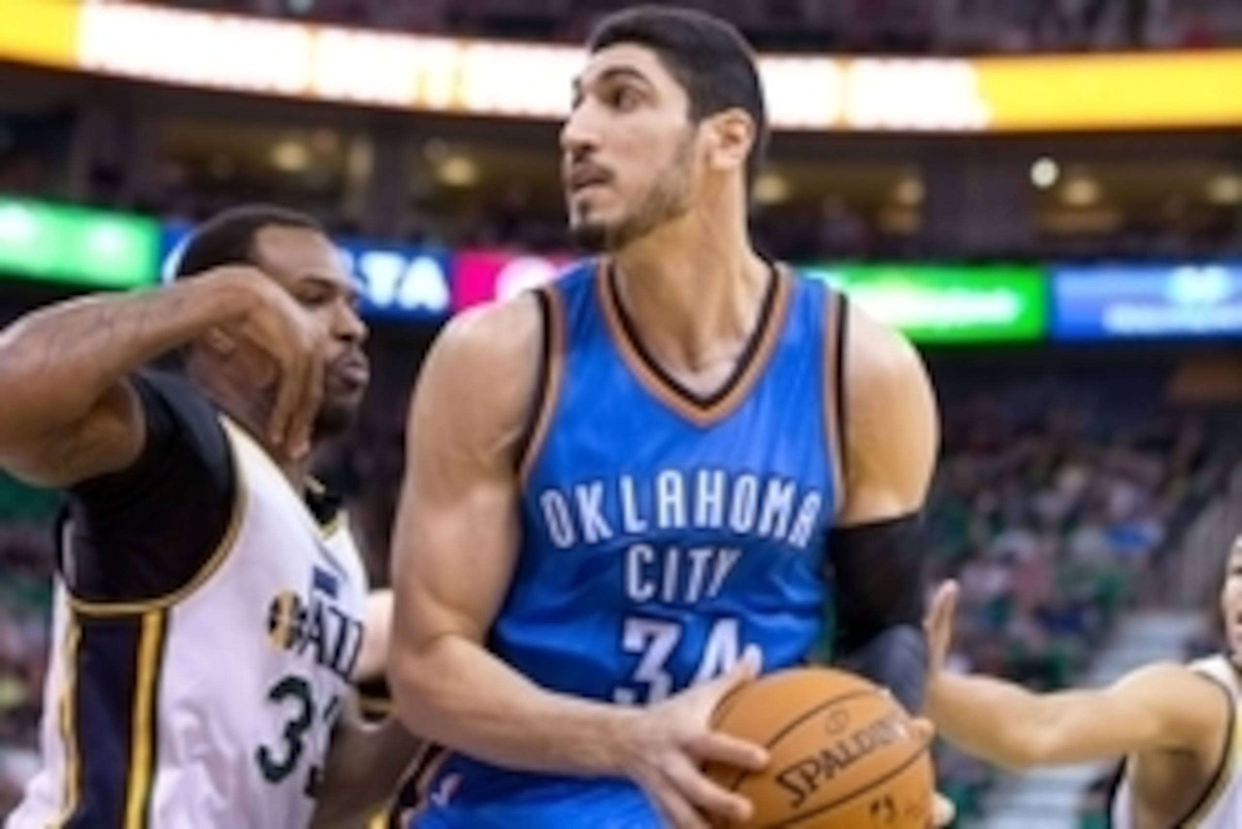 Mar 28, 2015; Salt Lake City, UT, USA; Utah Jazz forward Trevor Booker (33) defends against Oklahoma City Thunder center Enes Kanter (34) during the first quarter at EnergySolutions Arena. Mandatory Credit: Russ Isabella-USA TODAY Sports