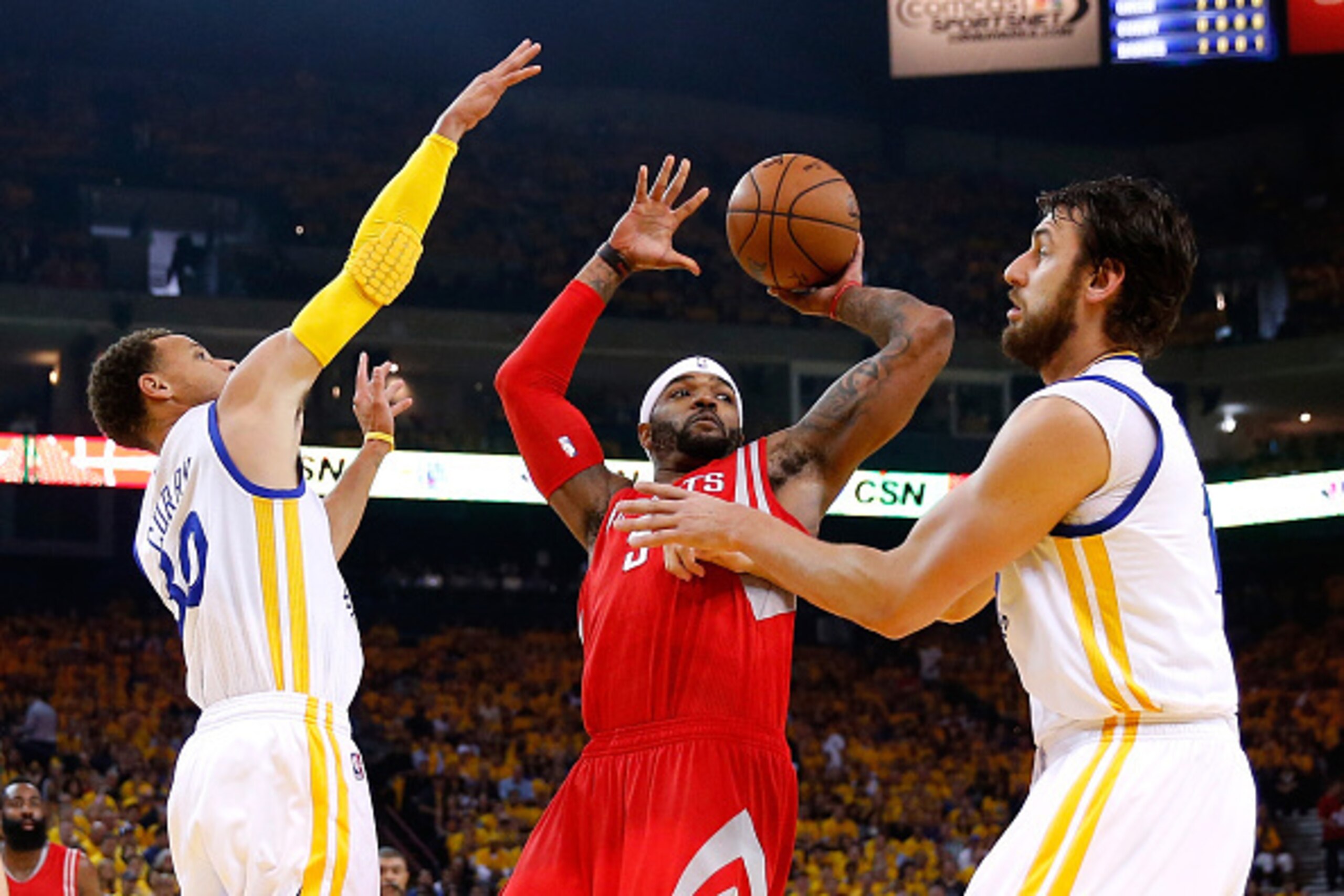 OAKLAND, CA - MAY 27:  Josh Smith #5 of the Houston Rockets with the ball against Stephen Curry #30 and Andrew Bogut #12 of the Golden State Warriors in the first half during game five of the Western Conference Finals of the 2015 NBA Playoffs at ORACLE Ar