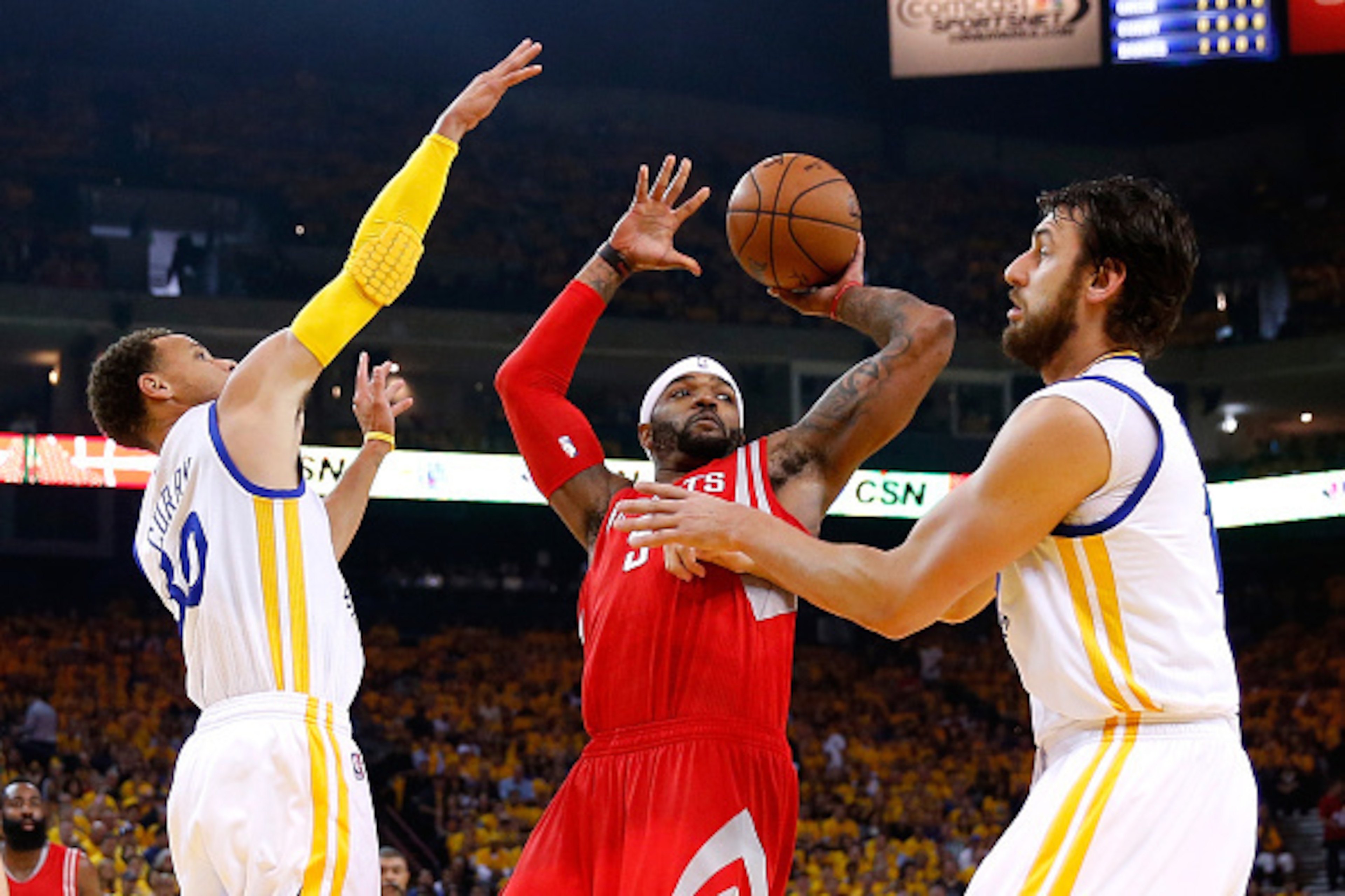 OAKLAND, CA - MAY 27:  Josh Smith #5 of the Houston Rockets with the ball against Stephen Curry #30 and Andrew Bogut #12 of the Golden State Warriors in the first half during game five of the Western Conference Finals of the 2015 NBA Playoffs at ORACLE Ar