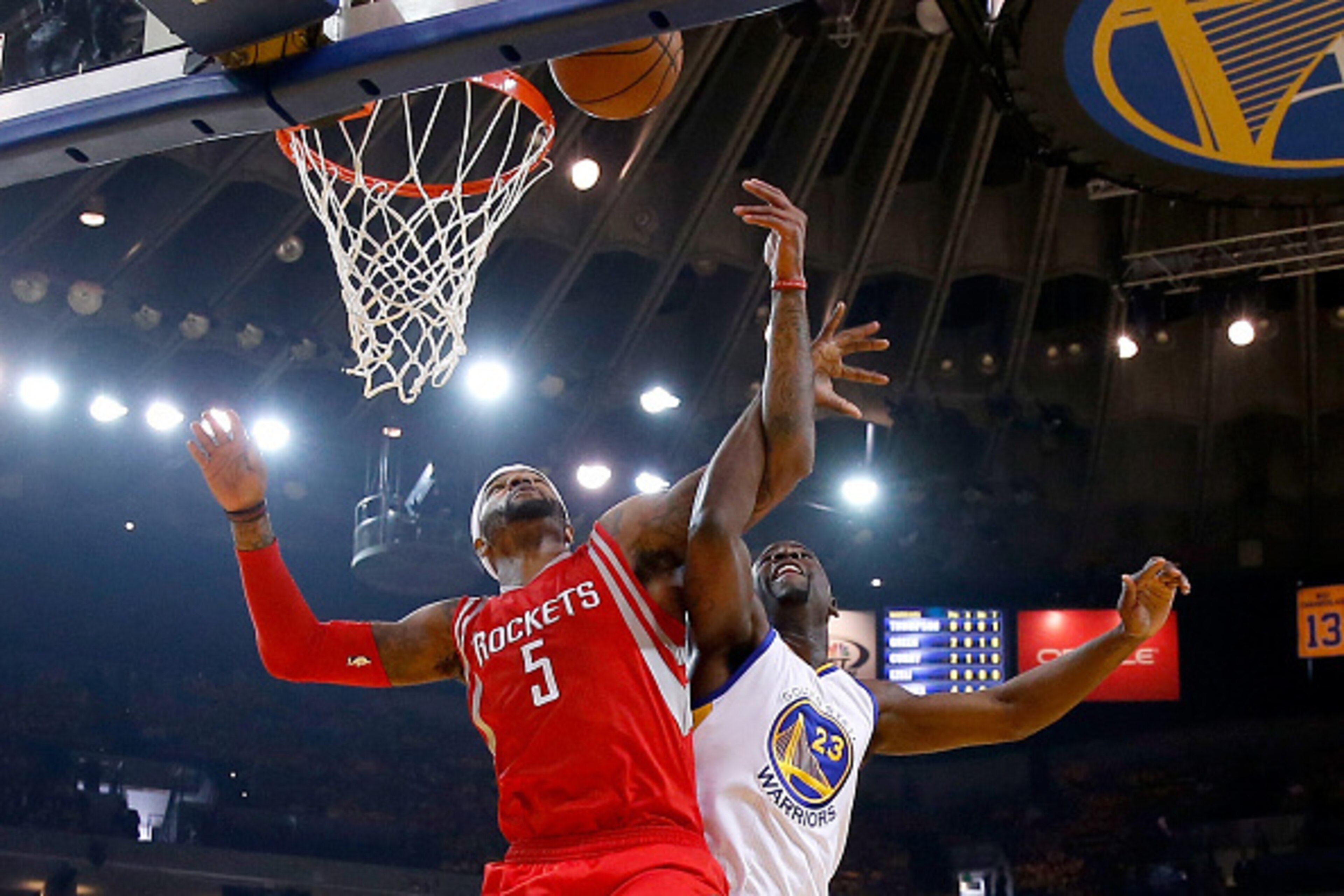 OAKLAND, CA - MAY 27:  Josh Smith #5 of the Houston Rockets goes up for the ball alongside Draymond Green #23 of the Golden State Warriors in the first half during game five of the Western Conference Finals of the 2015 NBA Playoffs at ORACLE Arena on May 