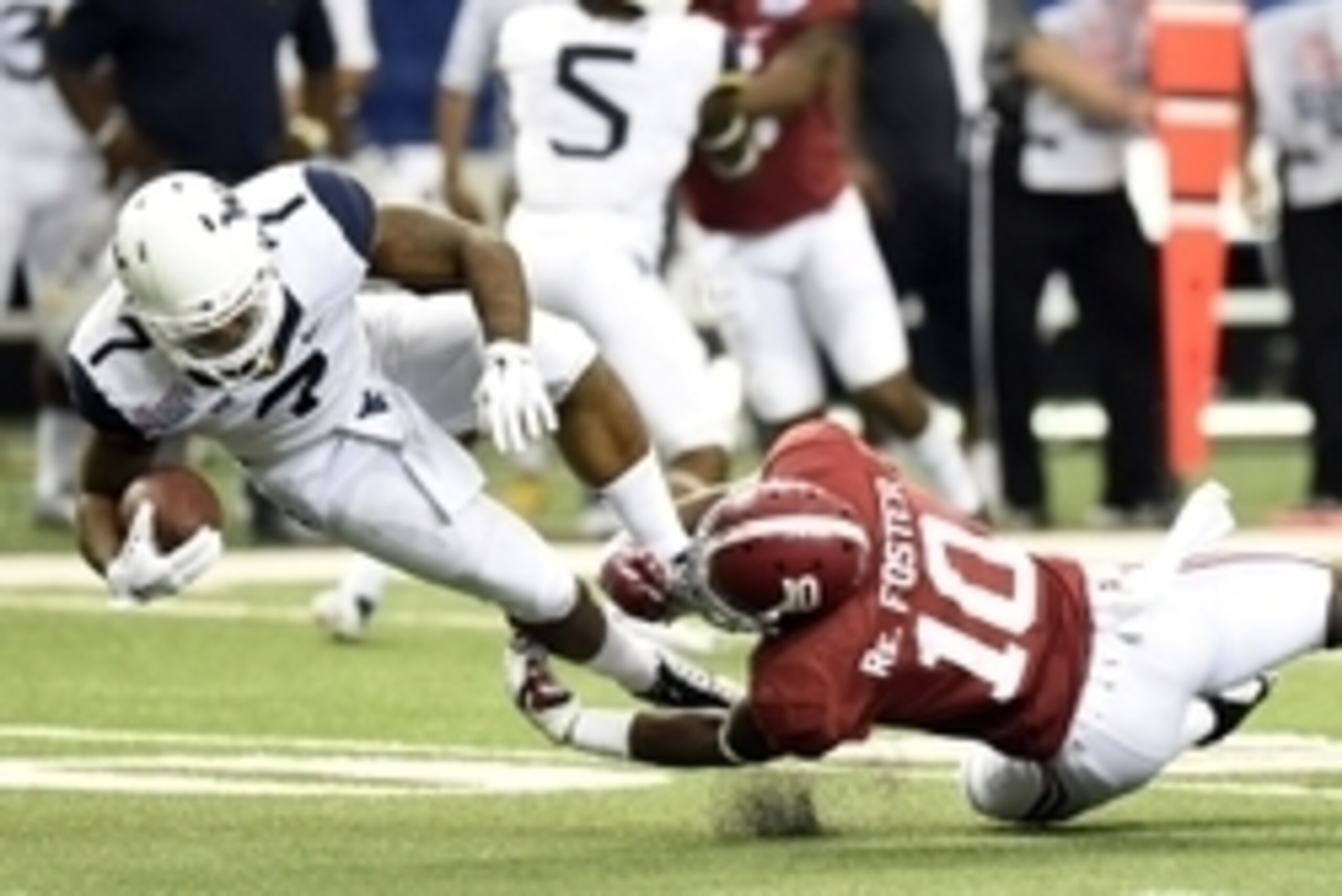 Aug 30, 2014; Atlanta, GA, USA; Alabama Crimson Tide linebacker Reuben Foster (10) tackles West Virginia Mountaineers running back Rushel Shell (7) during the third quarter of the 2014 Chick-fil-a kickoff game at Georgia Dome. Mandatory Credit: John David Aug 30, 2014; Atlanta, GA, USA; Alabama Crimson Tide linebacker Reuben Foster (10) tackles West Virginia Mountaineers running back Rushel Shell (7) during the third quarter of the 2014 Chick-fil-a kickoff game at Georgia Dome. Mandatory Credit: John David