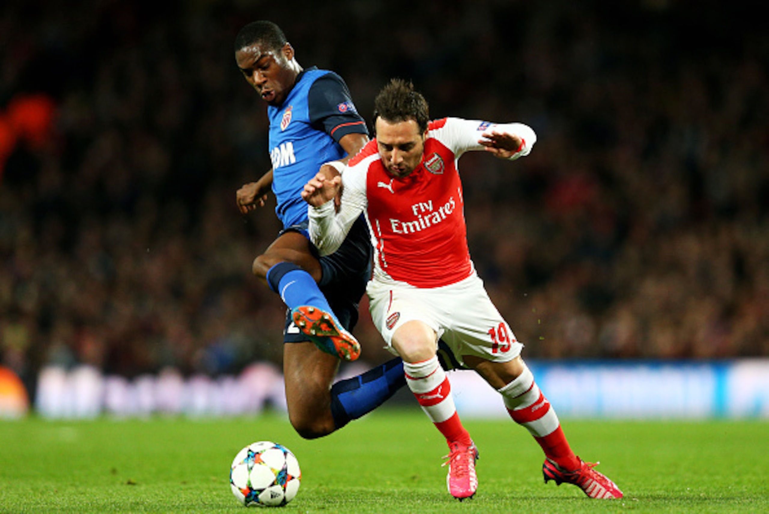 LONDON, ENGLAND - FEBRUARY 25: Geoffrey Kondogbia of Monaco and Santi Cazorla of Arsenal battle for the ball during the UEFA Champions League round of 16, first leg match between Arsenal and Monaco at The Emirates Stadium on February 25, 2015 in London, LONDON, ENGLAND - FEBRUARY 25: Geoffrey Kondogbia of Monaco and Santi Cazorla of Arsenal battle for the ball during the UEFA Champions League round of 16, first leg match between Arsenal and Monaco at The Emirates Stadium on February 25, 2015 in London,