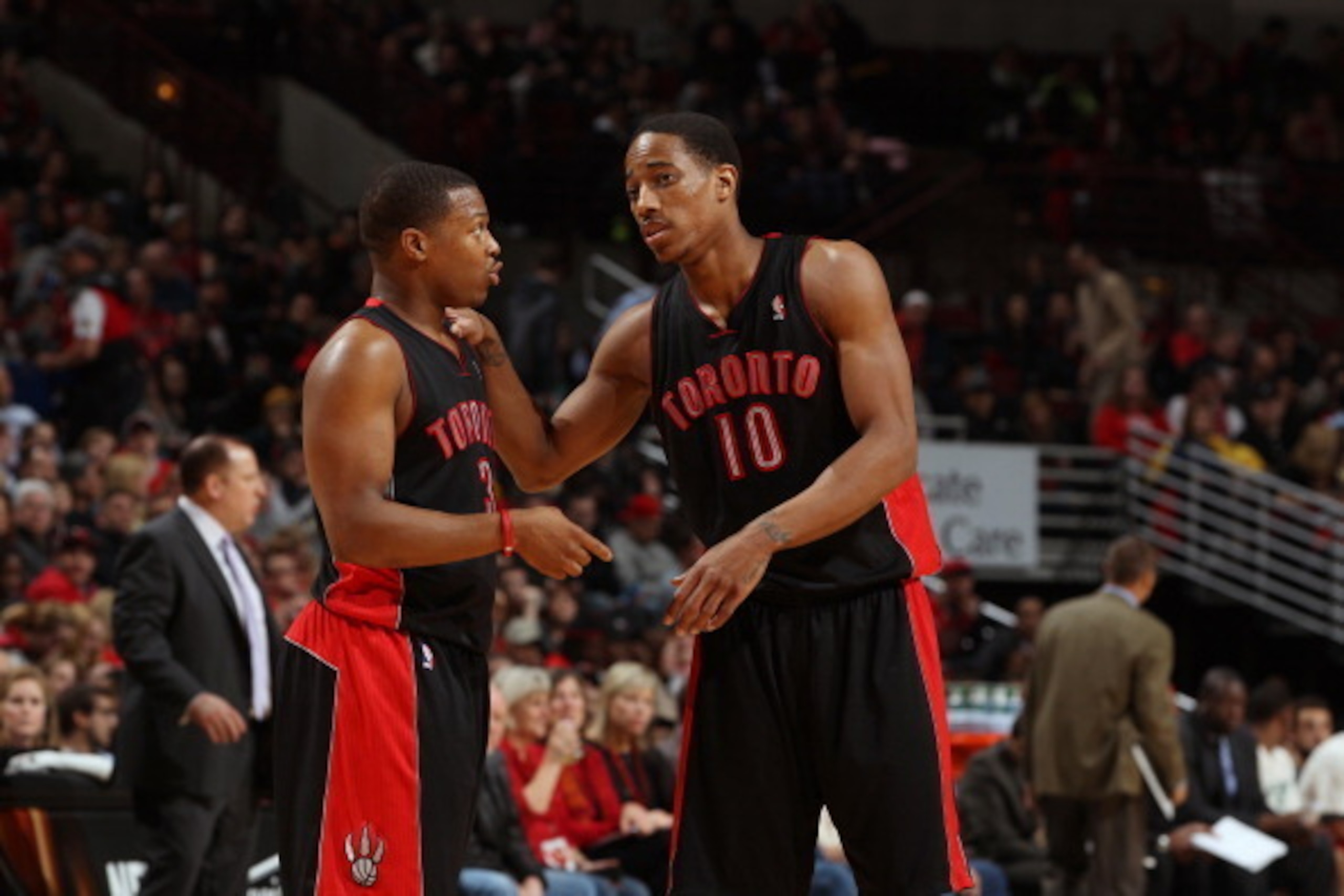 CHICAGO, IL - APRIL 9:  Kyle Lowry #3 and DeMar DeRozan #10 of the Toronto Raptors talk during the game against the Chicago Bulls on April 09, 2013 at the United Center in Chicago, Illinois. NOTE TO USER:  User expressly acknowledges and agrees that, by d
