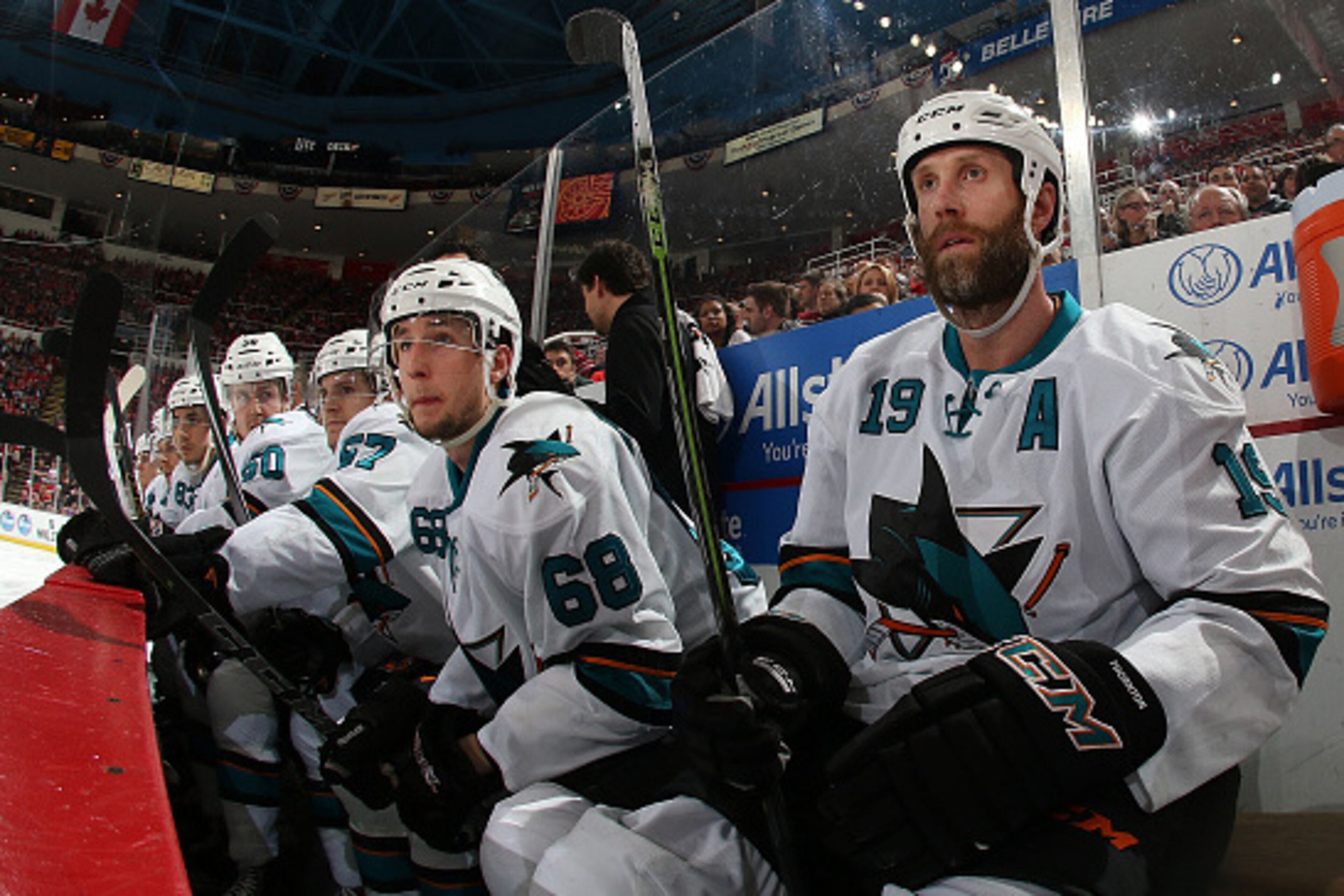 DETROIT, MI - MARCH 26: Joe Thornton #19 and Melker Karlsson #68 of the San Jose Sharks watch the action from the bench during a NHL game against the Detroit Red Wings on March 26, 2015 at Joe Louis Arena in Detroit, Michigan. The Sharks defeated the Wing