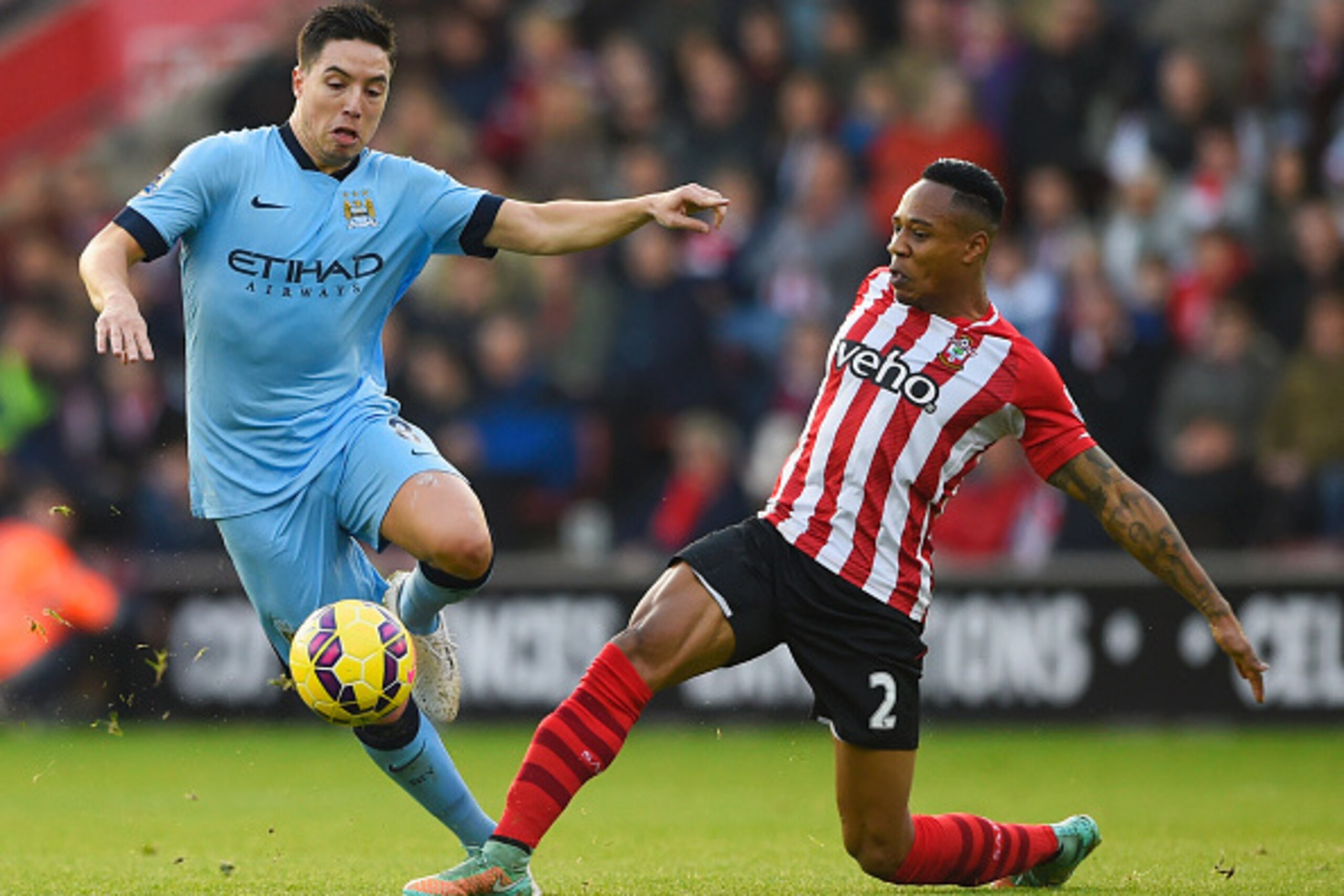 SOUTHAMPTON, ENGLAND - NOVEMBER 30:  Samir Nasri of Manchester City takes on Nathaniel Clyne of Southampton during the Barclays Premier League match between Southampton and Manchester City at St Mary's Stadium on November 30, 2014 in Southampton, England.
