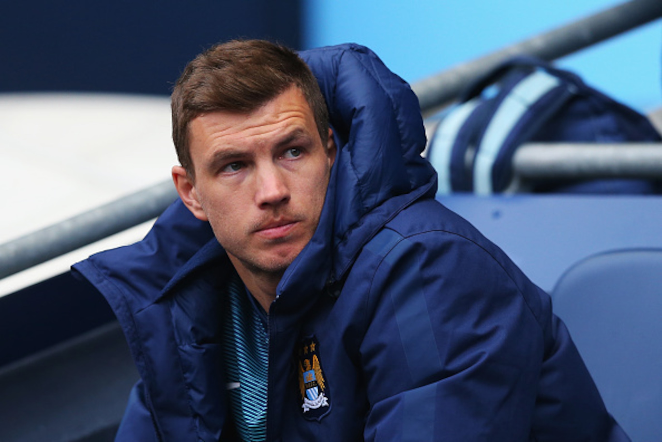 MANCHESTER, ENGLAND - APRIL 25: Edin Dzeko of Manchester City looks on from the bench during the Barclays Premier League match between Manchester City and Aston Villa at Etihad Stadium on April 25, 2015 in Manchester, England.  (Photo by Alex Livesey/Gett