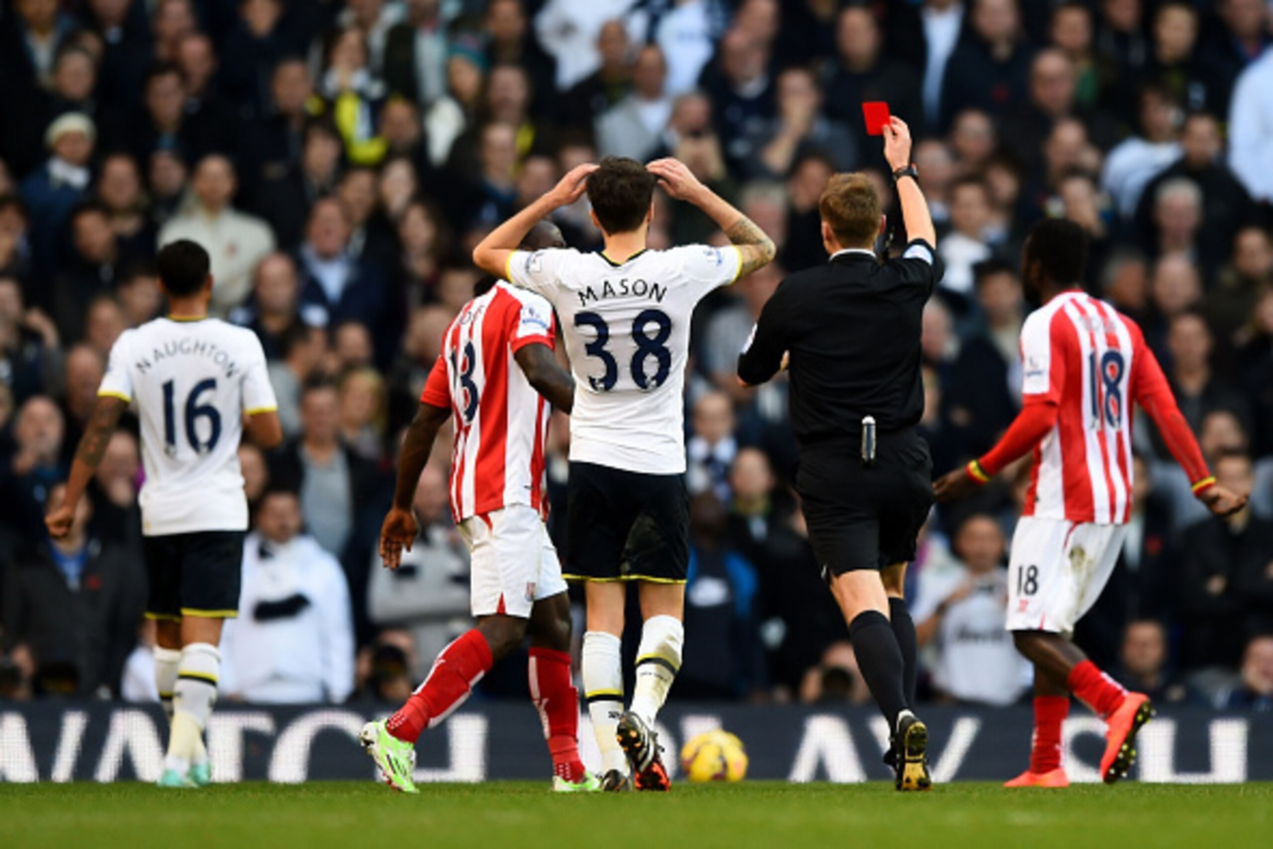 LONDON, ENGLAND - NOVEMBER 09: Referee Mike Jones shows the red card to Kyle Naughton #16 (L) of Spurs during the Barclays Premier League match between Tottenham Hotspur and Stoke City at White Hart Lane on November 9, 2014 in London, England. (Photo by LONDON, ENGLAND - NOVEMBER 09: Referee Mike Jones shows the red card to Kyle Naughton #16 (L) of Spurs during the Barclays Premier League match between Tottenham Hotspur and Stoke City at White Hart Lane on November 9, 2014 in London, England. (Photo by