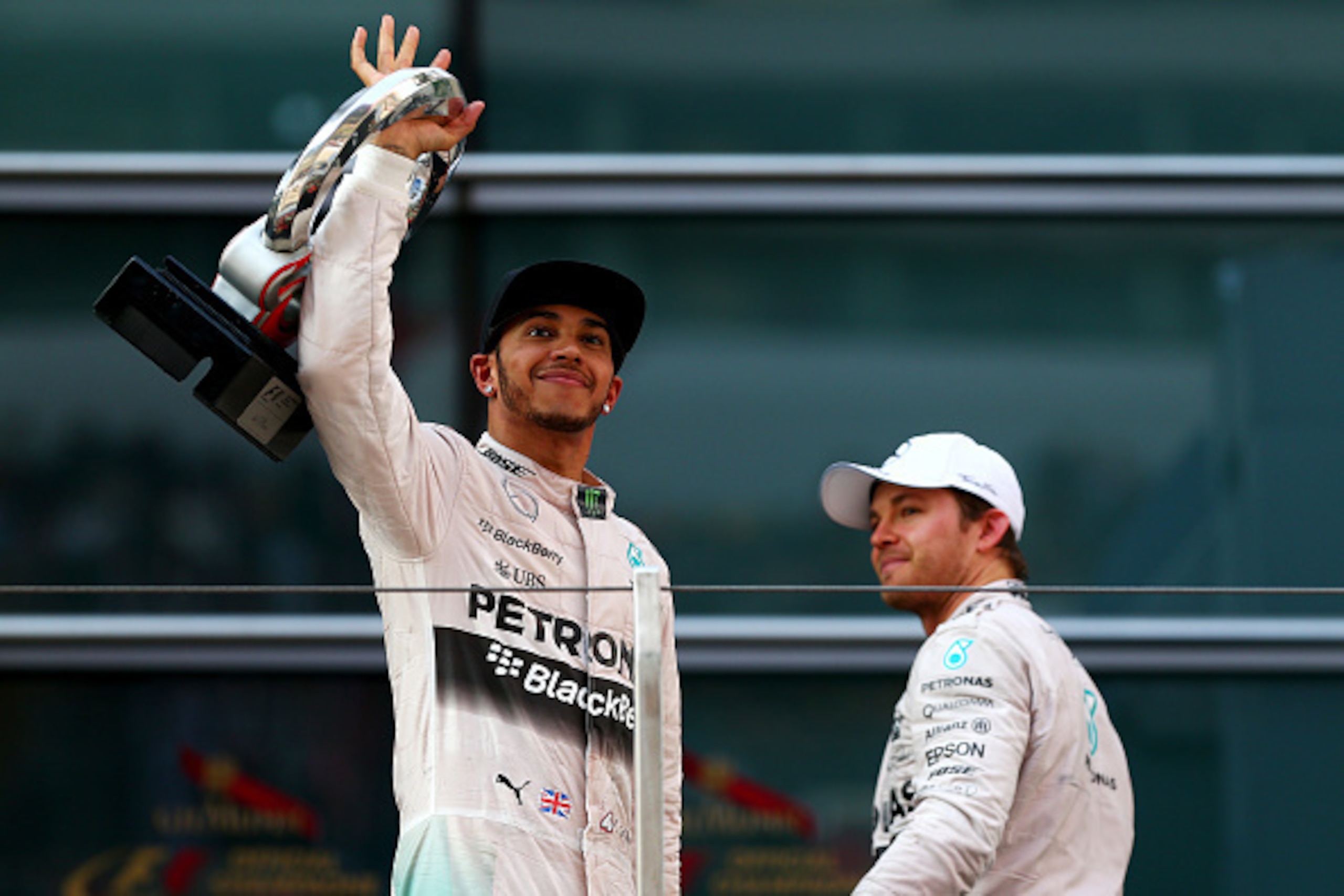 SHANGHAI, CHINA - APRIL 12:  Lewis Hamilton of Great Britain and Mercedes GP celebrates on the podium next to Nico Rosberg of Germany and Mercedes GP after winning the Formula One Grand Prix of China at Shanghai International Circuit on April 12, 2015 in 