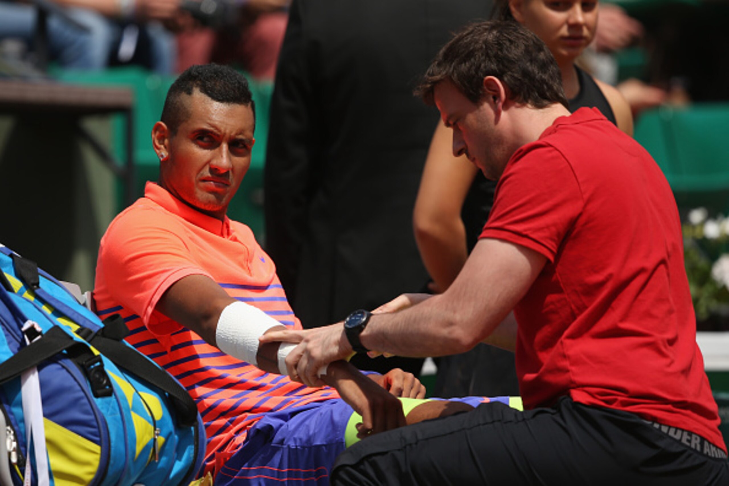 PARIS, FRANCE - MAY 30:  Nick Kyrgios of Australia receives medical treatment in his Men's Singles match against Andy Murray of Great Britain on day seven of the 2015 French Open at Roland Garros on May 30, 2015 in Paris, France.  (Photo by Clive Brunskil
