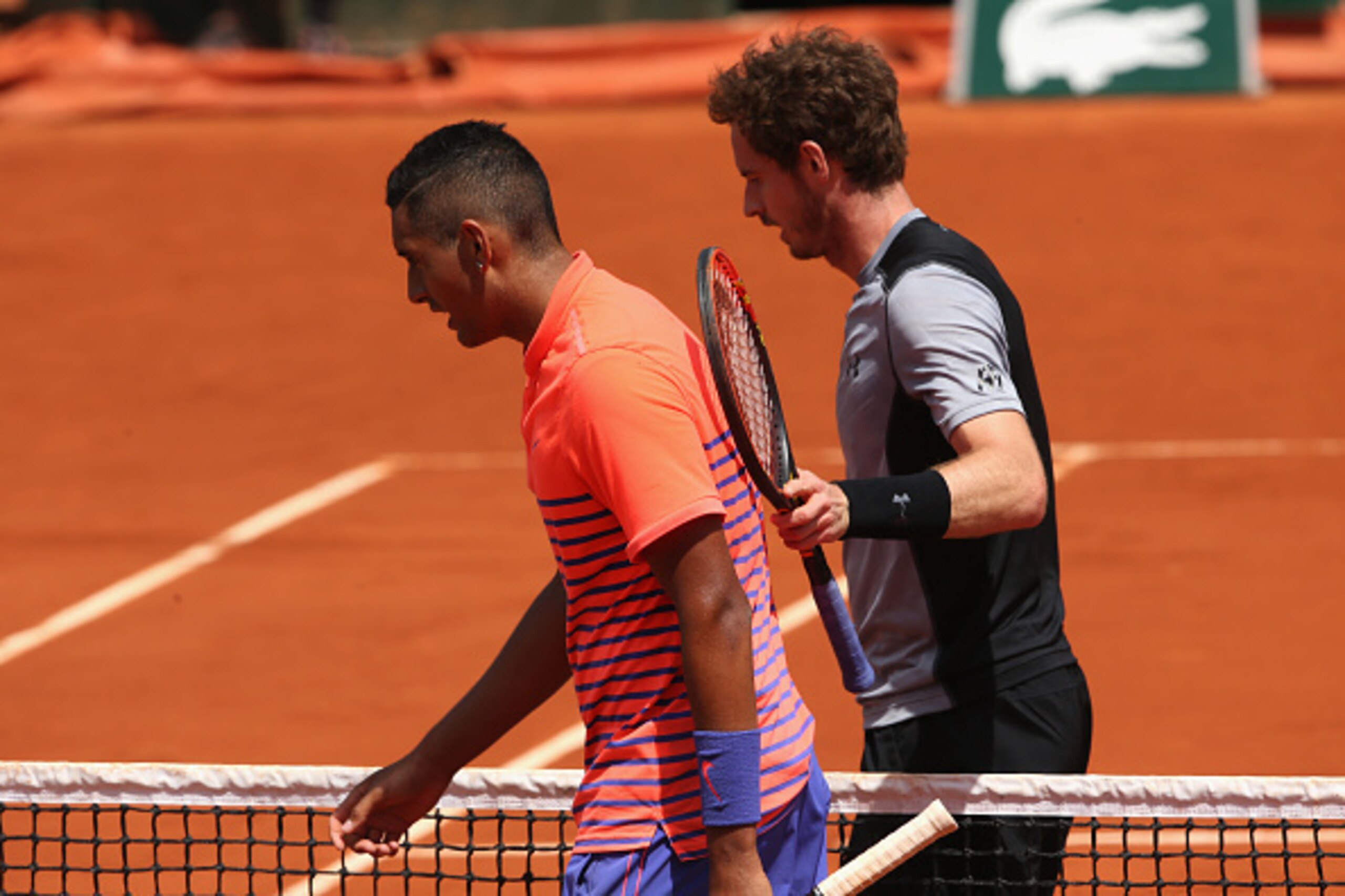 PARIS, FRANCE - MAY 30:  Andy Murray of Great Britain consoles Nick Kyrgios of Australia  after their Men's Singles match  on day seven of the 2015 French Open at Roland Garros on May 30, 2015 in Paris, France.  (Photo by Clive Brunskill/Getty Images)