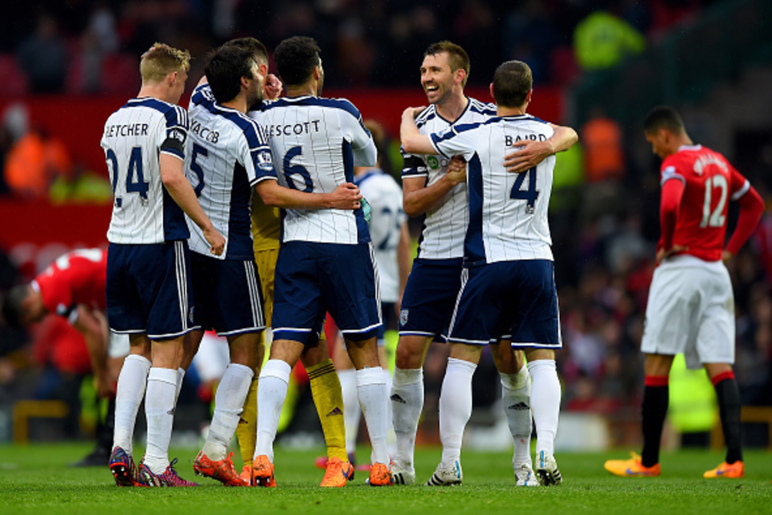 MANCHESTER, ENGLAND - MAY 02:  West Brom players celebrate after the Barclays Premier League match between Manchester United and West Bromwich Albion at Old Trafford on May 2, 2015 in Manchester, England.  (Photo by Shaun Botterill/Getty Images)