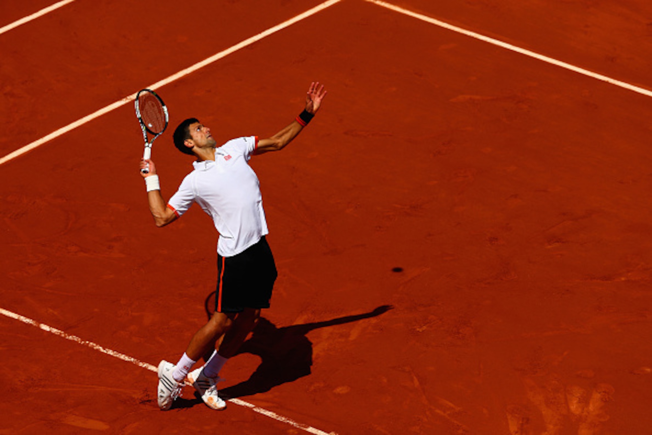 PARIS, FRANCE - MAY 30: Novak Djokovic of Serbia serves in his Men's Singles match against Thanasi Kokkinakis of Australia on day seven of the 2015 French Open at Roland Garros on May 30, 2015 in Paris, France. (Photo by Clive Mason/Getty Images) PARIS, FRANCE - MAY 30: Novak Djokovic of Serbia serves in his Men's Singles match against Thanasi Kokkinakis of Australia on day seven of the 2015 French Open at Roland Garros on May 30, 2015 in Paris, France. (Photo by Clive Mason/Getty Images)