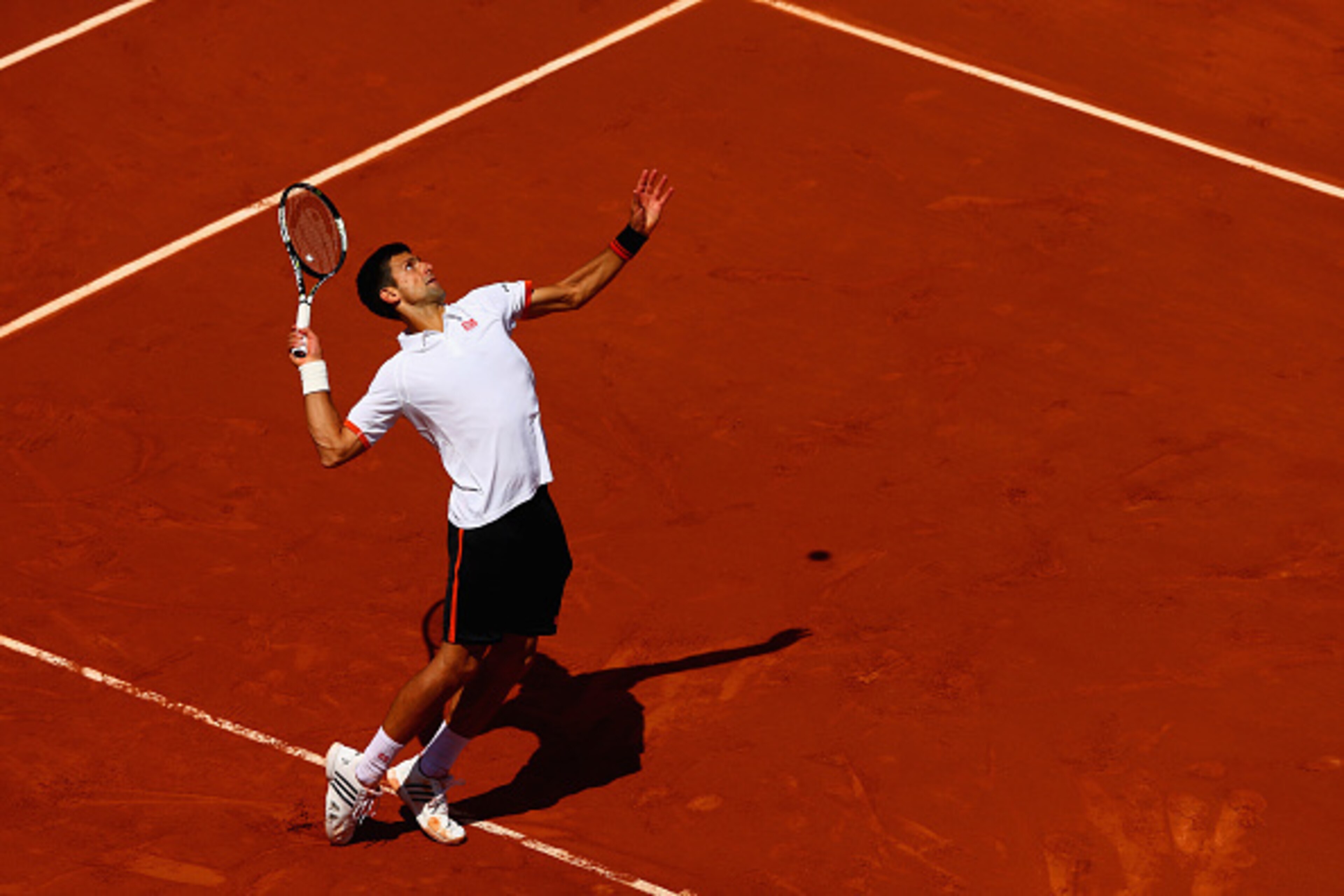 PARIS, FRANCE - MAY 30: Novak Djokovic of Serbia serves in his Men's Singles match against Thanasi Kokkinakis of Australia on day seven of the 2015 French Open at Roland Garros on May 30, 2015 in Paris, France. (Photo by Clive Mason/Getty Images) PARIS, FRANCE - MAY 30: Novak Djokovic of Serbia serves in his Men's Singles match against Thanasi Kokkinakis of Australia on day seven of the 2015 French Open at Roland Garros on May 30, 2015 in Paris, France. (Photo by Clive Mason/Getty Images)