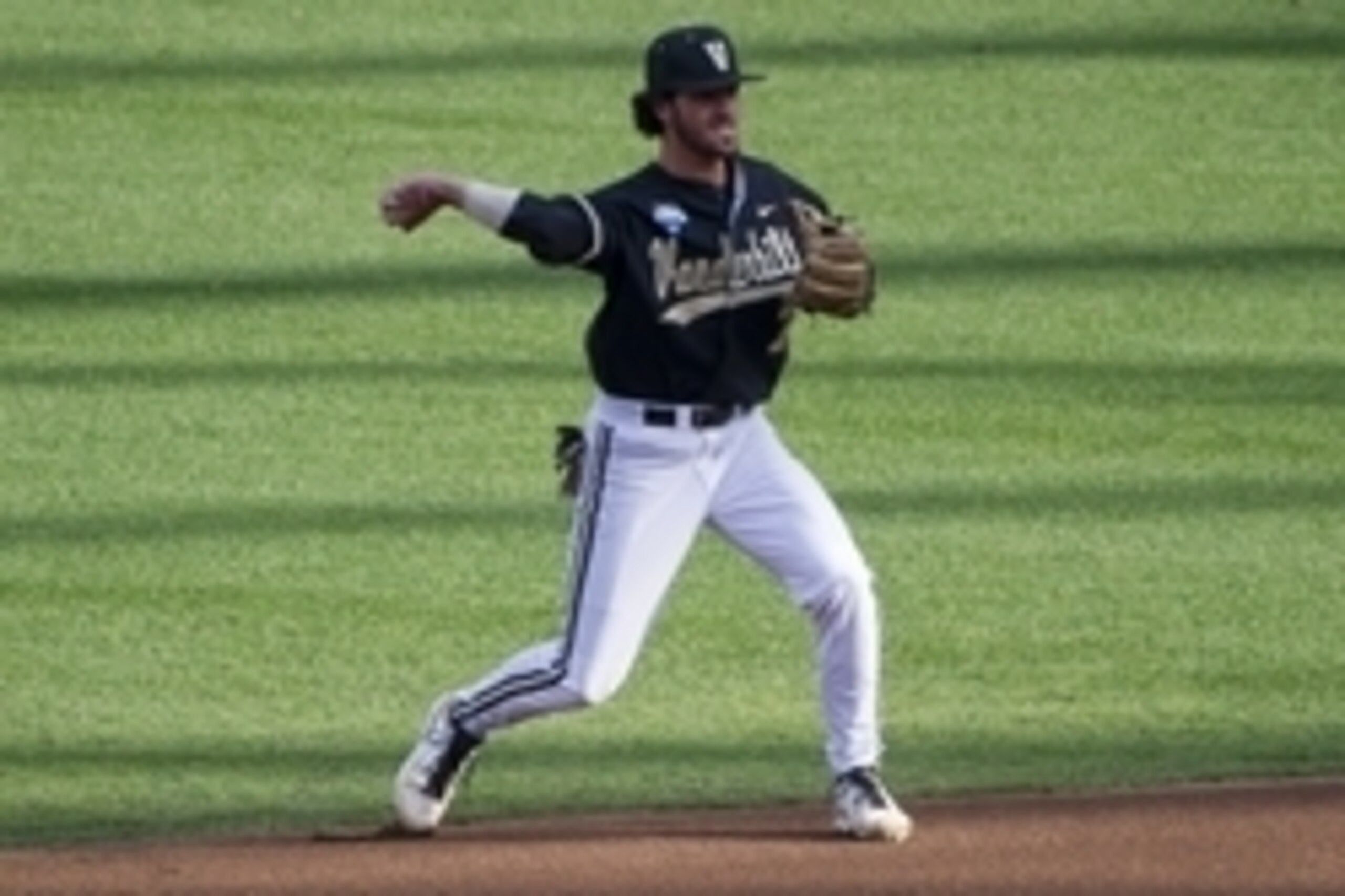 Jun 24, 2014; Omaha, NE, USA; (Editor's Note: Caption Correction) Vanderbilt Commodores infielder Dansby Swanson (7) makes the throw to first base against the Virginia Cavaliers during game two of the College World Series Finals at TD Ameritrade Park Oma Jun 24, 2014; Omaha, NE, USA; (Editor's Note: Caption Correction) Vanderbilt Commodores infielder Dansby Swanson (7) makes the throw to first base against the Virginia Cavaliers during game two of the College World Series Finals at TD Ameritrade Park Oma