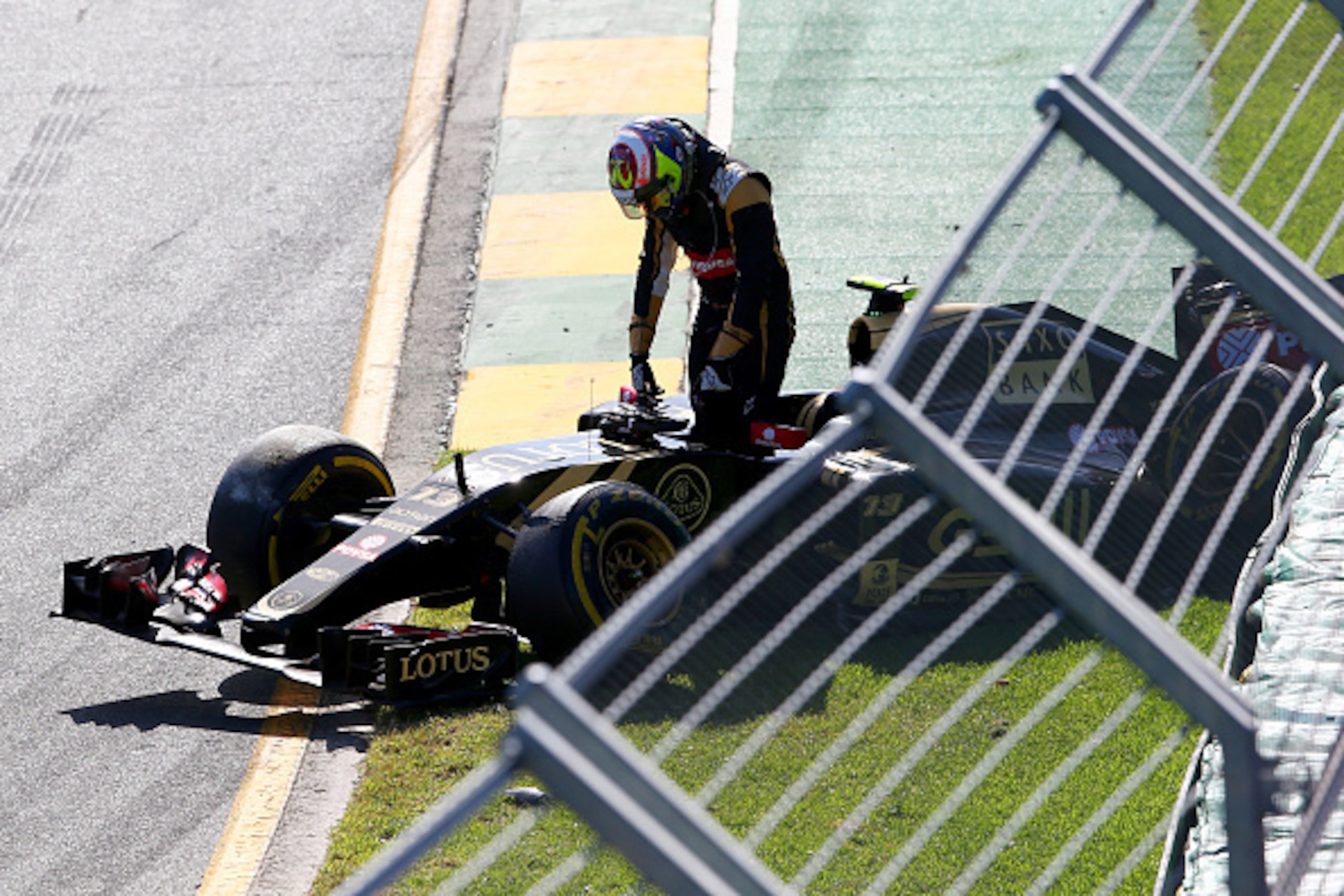 MELBOURNE, AUSTRALIA - MARCH 15:  Pastor Maldonado of Venezuela and Lotus crashes at the second corner during the Australian Formula One Grand Prix at Albert Park on March 15, 2015 in Melbourne, Australia.  (Photo by Mark Thompson/Getty Images)