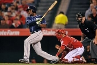 May 27, 2015; Anaheim, CA, USA; San Diego Padres left fielder Justin Upton (10) hits an RBI single in the seventh inning against the Los Angeles Angels at Angel Stadium of Anaheim. Mandatory Credit: Gary A. Vasquez-USA TODAY Sports