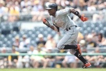 May 27, 2015; Pittsburgh, PA, USA; Miami Marlins second baseman Dee Gordon (9) steals second base against the Pittsburgh Pirates during the third inning at PNC Park. Mandatory Credit: Charles LeClaire-USA TODAY Sports